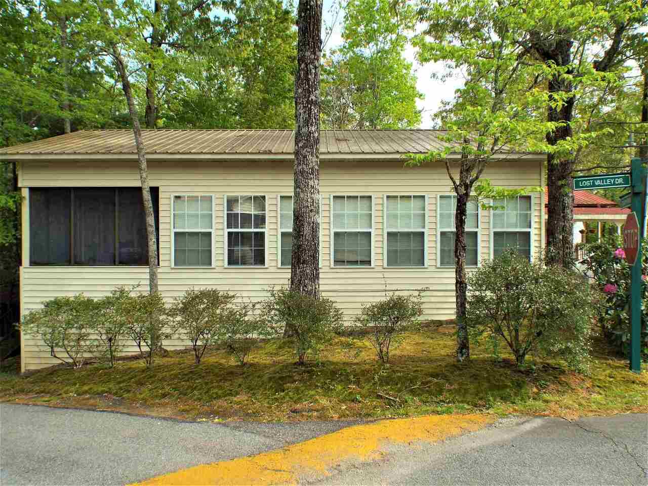 1 bedroom 1 bath Park Model with roof over and large open room addition, back screened porch all set up on a nice corner lot and Located in a 5 star resort with a clubhouse, putt putt golf, diner, church, stables, Indoor pool, sauna, steam room, spa, 50 acre lake and much more