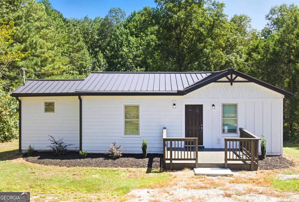 Welcome to this beautifully renovated 3-bedroom, 2-bath home on a generous 1.3-acre lot in Winston, GA. Featuring a modern open floor plan, this residence is ideal for both everyday living and entertaining. The brand-new kitchen boasts sleek quartz countertops, custom cabinetry, and ample space for gatherings. Every detail has been thoughtfully upgraded-new electrical, plumbing, HVAC, septic system, flooring, and fully remodeled bathrooms-all completed with county approval for peace of mind. The spacious lot offers room to create your own outdoor retreat, whether for gardening, recreation, or enjoying quiet evenings. With its convenient location, you'll appreciate easy access to I-20, shopping, and dining, while still enjoying the privacy and space of a large homesite. This turnkey property blends comfort, style, and function-move-in ready and designed to be enjoyed for years to come.