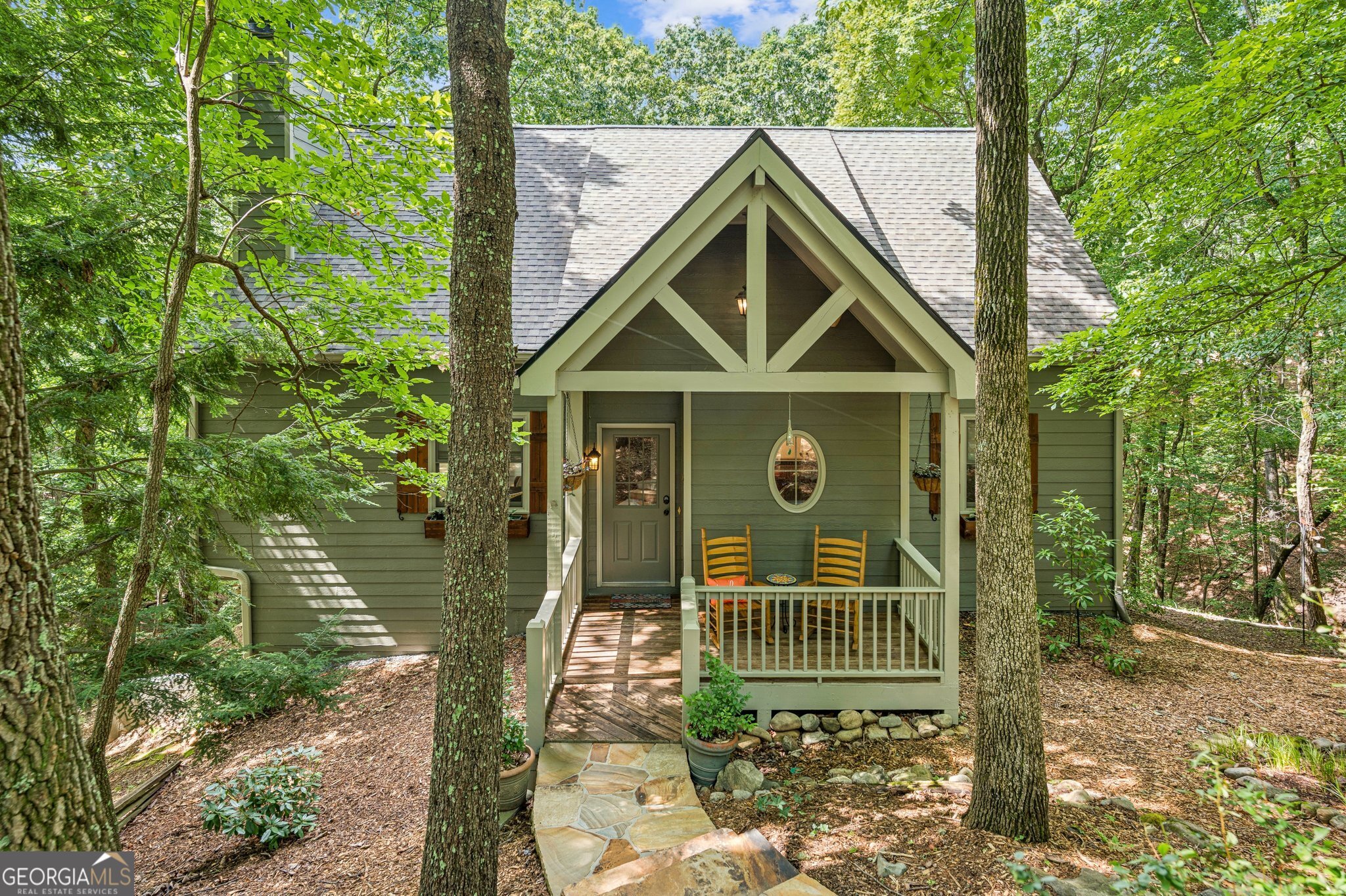 Charming Cul-de-Sac Home in Big Canoe! Offering privacy, quality, and tasteful updates, this home is move-in ready and designed for relaxed mountain living. Welcome to 121 Laughing Fox Knl - a beautifully maintained 4-bedroom, 3-bath home tucked at the end of a quiet cul-de-sac in the prestigious Big Canoe community. Located near trails and creeks-Indian Rocks Park. Soaring vaulted wood ceilings in the Great Room with a stunning floor-to-ceiling stone fireplace and expansive windows that flood the space with natural light Open-concept layout connects the cozy kitchen and breakfast bar to the living area - perfect for entertaining The loft has additional space for office, crafts or quiet time. There is no lack of storage space in this home. New fixtures, hardwood floors (2023), and a host of stylish finishes throughout. Primary suite features an updated master bath (2016) and serene views of the surrounding woods. Enjoy the fresh mountain air from the screened-in porch and adjoining deck. Professionally landscaped yard with retaining wall and screened in patio, outside grilling patio (2020) and a newly added parking pad and walkway (2019). Roof replaced in 2025. New appliances: Stove (2024), Dishwasher (2023), Fridge (2022), Washer/Dryer (2016) Main Level Laundry room with sink. Windows and porch doors replaced in 2018. Furnace & dual-fuel AC system (2021). Exterior painted (2023), gutters and guards (2016), and rerouted dryer vent (2022). Terrace level has a family room, bedroom and screened patio for the family or guests to spread out. The terrace level is already plumbed for a bath and ready for your finishing touches-ideal for a game room, guest suite, or media area. This home blends comfort and craftsmanship in one of Big Canoe's most desirable settings. Whether you're looking for a full-time residence or a weekend escape, this property checks all the boxes. Furnishings available under a separate bill of sale. ***A mandatory $4,500.00 capital contribution fee paid by the purchaser to the Big Canoe Property Owners' Association will be due at closing. Pursuant to Article II, Section 1, Paragraph bb of the Class "A" Covenants for the Big Canoe community, all property transfers are subject to the Big Canoe developer's right of first refusal.