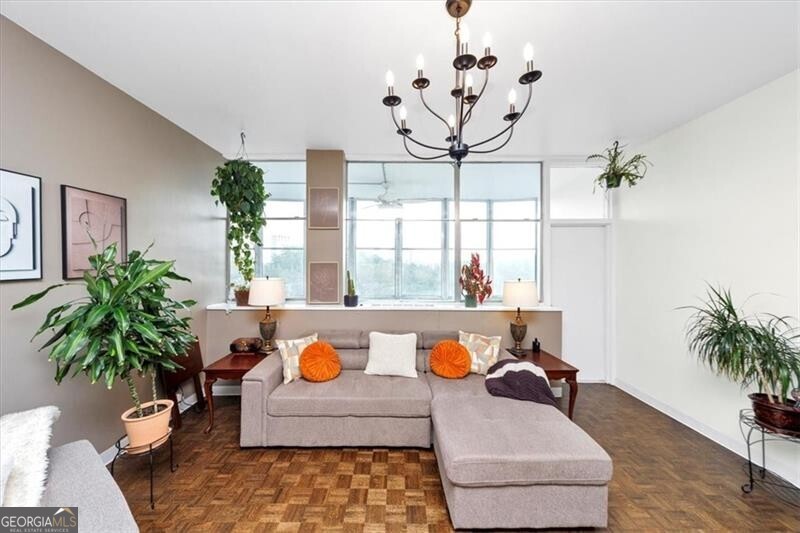 Discover this beautifully updated $40k in renovations Buckhead condo in a classic mid-century building, boasting a spacious 30-foot open-air sunroom balcony perfect for relaxing or entertaining. Inside, enjoy a gourmet kitchen, a primary bedroom with a walk-in closet and balcony access, a secondary bedroom, a dedicated office nook, and a flat HOA fee covering unlimited utilities and all building maintenance. Residents benefit from a full suite of amenities, including a saltwater pool, 24/7 controlled access, and highly rated schools (7-9). This gem offers serene, private living with effortless access to Buckhead Village Phipps Plaza & Lenox Square for premier shopping, dining, and entertainment-just a short stroll away! The kitchen shines with top-of-the-line stainless steel appliances, sage green shaker-style cabinets, honed premium granite countertops, a herringbone white tiled backsplash, a matte black and copper-accented faucet, an oversized sink, corner shelves for ample storage, and a generously sized pantry. Rich dark walnut stained hardwood floors flow throughout, complemented by wall-to-wall windows that flood the home with natural light year-round. The open-concept layout seamlessly connects the kitchen to a sun-drenched family room via wall-to-wall windows, while a hallway ensures privacy for the two spacious bedrooms. The bathroom impresses with a large vanity, high-arc faucet, expansive framed mirror, space-saving ventless washer-dryer, and elegant white tiled floors. Step outside to one of the city's largest communal green spaces-over four acres of lush landscaped grounds with mature trees, ideal for summer barbecues and poolside social gatherings. For active lifestyles, nearby attractions include Frankie Allen Park, Chastain Park, Bobby Jones Golf Course, and the Atlanta BeltLine, offering fields, tennis courts, pools, and golf. Explore the scenic Swan House and Gardens, savor upscale experiences in Buckhead Village, or shop conveniently at Whole Foods, Publix, or Trader Joe's, with charming coffee shops nearby. Enjoy abundant parking, an oversized storage unit. Embrace hassle-free, luxurious living tailored for you and your family for years!