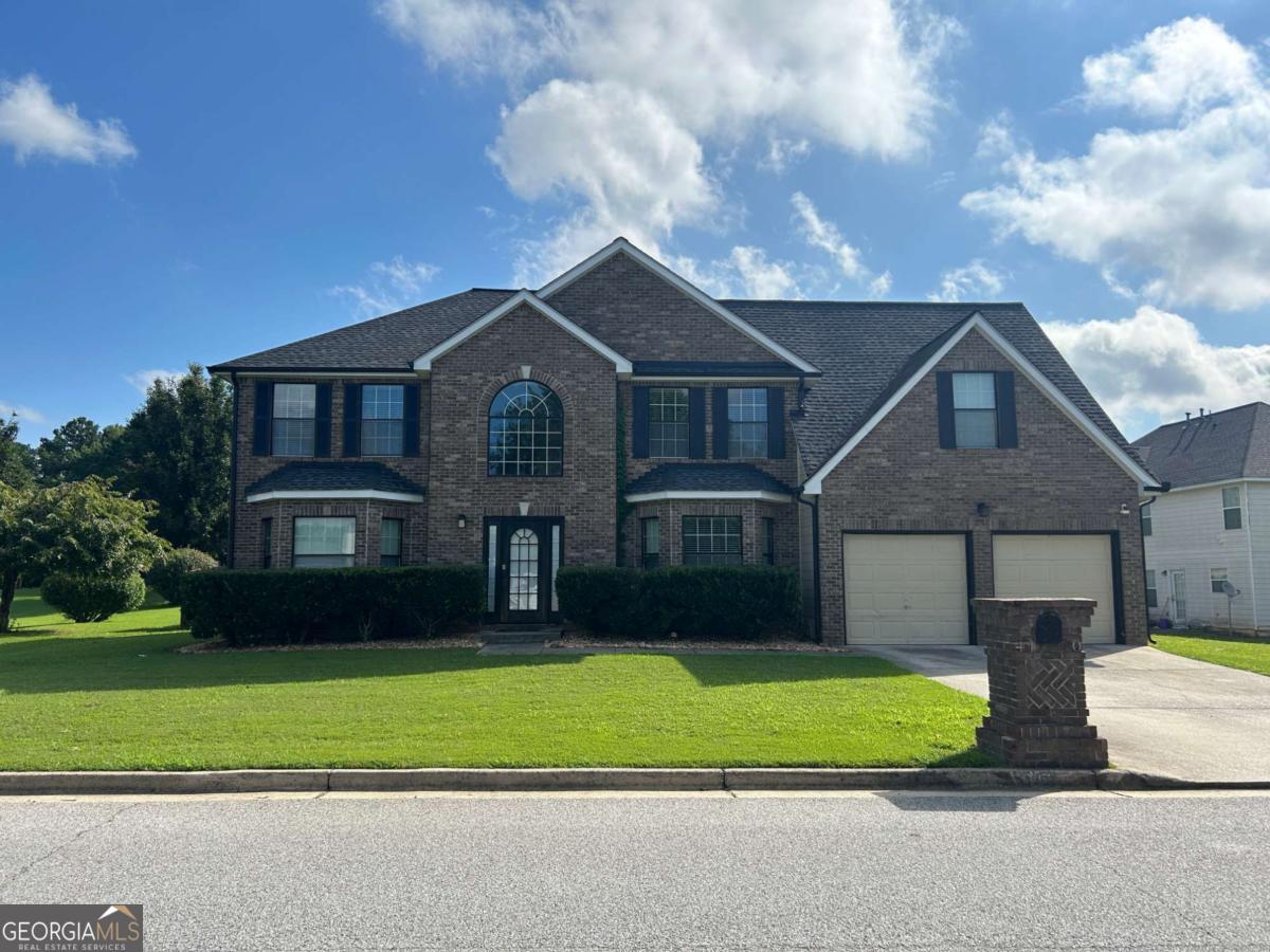 Welcome home to this stunning 5 bedroom 3 full bathroom home located in the desirable community of Cooks Landing! This home sits on a corner lot and features over 3100 sq ft, dual staircases, a formal living room and dining room, eat in kitchen and so much more! On the first floor you will find a breathtaking foyer which leads you into one of the 5 bedrooms and a full bathroom along with the laundry room! The spacious kitchen is complete with a pantry and looks into the family room! Off the family room you will find a private staircase heading to the enormous master suite equipped with your very own fireplace, large sitting area and vaulted ceilings. The master bathroom has 2 sinks, soaking tub, separate shower and a walk in closet! The 4 secondary bedrooms are ample in size and full of natural light! The backyard is fenced in for your privacy and perfect for entertaining! This home is conveniently located just 20 minutes from Hartsfield Jackson Airport, Hwy 92, shopping and more! Truly a must see!