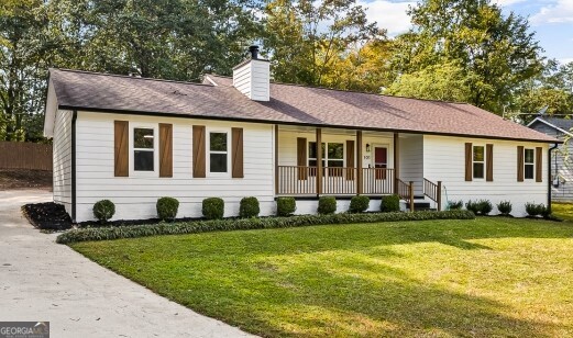 Welcome to 101 Shannon Chase Lane - a beautifully updated home that blends modern upgrades with comfort and charm! Step inside and be greeted by gleaming LVP flooring throughout, paired with brand new windows that bring in natural light and energy efficiency. The sunroom features oversized windows with built-in ceiling fans and enhanced lighting, creating the perfect spot to relax year-round. The exquisite kitchen boasts a designer lighting package and state-of-the-art stainless steel appliances - including a matching refrigerator, stove, microwave, and dishwasher. Gather in the living room around the exceptional corner brick fireplace, perfectly accented by a dramatic helicopter ceiling fan. The exterior is just as impressive! A private oversized backyard offers endless possibilities, fully fenced for peace of mind. Relax or entertain on the expansive back deck while enjoying the tranquil natural surroundings. The oversized driveway provides ample parking, complemented by a 2-car garage and a charming barn-style outdoor shed for extra storage. This home is truly a serene retreat, combining comfort, function, and style in every detail. Don't miss the opportunity to make it yours!