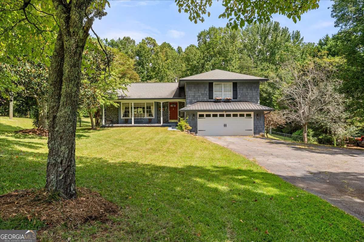 Location! Location! Location! Sitting on almost 3 full acres in the heart of West Cobb, just minutes from Dallas Highway is the perfect investment opportunity for either a remodel or tear down for a luxury new construction home! Custom-built in 1973 the home features three full levels plus a partial unfinished basement, a 2015 roof, HVAC installed in 2021, and a large in-ground pool with a fenced backyard. Home is located 2.5 miles from Hillgrove Highschool, a half mile from Kemp Elementary making the location perfect for a growing family. Schedule your showing today!