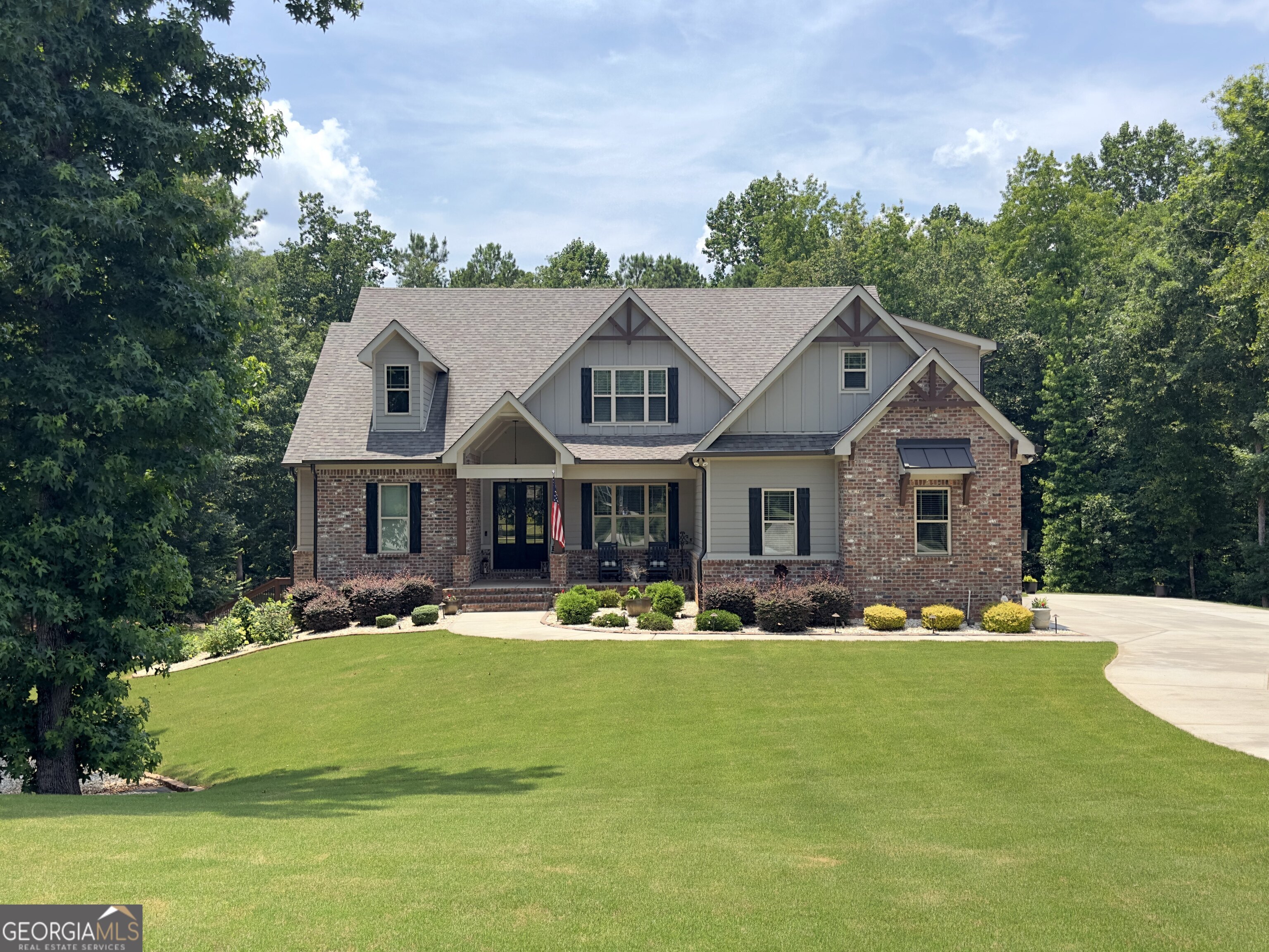 Welcome to your dream home at 310 Preakness Way, a stunning residence nestled in the serene and sought-after Riata community of Forsyth, Georgia. This exquisite home blends modern elegance with Southern charm, offering a perfect retreat for families, professionals, or anyone seeking a peaceful lifestyle with convenient access to urban amenities. Spanning 3000 sq ft with an additional 2054 sq ft unfinished basement, the home features 4 bedrooms and 3.5 bathrooms with bonus room, providing ample space for comfortable living and entertaining. The gourmet kitchen, the heart of the home, boasts quartz countertops, stainless steel appliances, a large center island, and custom cabinetry, making it ideal for culinary enthusiasts and family gatherings. Appliances include double wall oven, built in stove top, built in microwave, and dishwwasher. The bright and airy living area, with high ceilings, hardwood floors, and large windows, flows seamlessly into the dining space, creating an inviting atmosphere filled with natural light. Off of the dining room there is a covered porch which has a fireplace as the focal point overlooking the well maintained back yard with fire pit area and sprinkler system. This space offers a perfect setting for barbecues and relaxation. The primary suite offers a beautiful space for peaceful sleeping and complete relaxation in the primary bath that consists of double vanity, soaking tub and oversized tile shower. The primary large walk in closet has built ins for easy organization. On the second level you have two more nice sized secondary bedrooms and a large bonus room and a full bath. The unfinished basement offers space for anything you might want it to be. It is stubbed for an additional bathroom. Walking outside from the basement, you will enjoy another covered patio space. Located in a family-friendly neighborhood, the home provides access to a community pool and playground. Situated just minutes from downtown Forsyth, top-rated schools, shopping, dining, and major highways like I-75, this home ensures easy commutes to Macon and Atlanta.