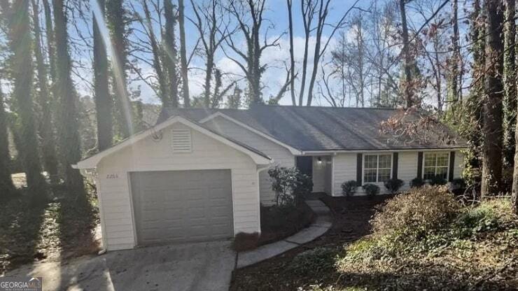 Welcome to this charming 3-bedroom, 2-bath ranch home located in a highly sought-after East Cobb neighborhood with excellent schools! This delightful property combines comfort, style, and convenience, making it the perfect place to call home. Interior Features: Great Room: The spacious great room features vaulted ceilings and a cozy fireplace, creating a warm and inviting atmosphere. Kitchen: Bright white kitchen cabinets paired with stainless steel appliances make for a modern and functional cooking space. Dining Area: The open dining area seamlessly connects to the great room, offering a perfect layout for entertaining or family meals. Flooring: Easy-to-maintain laminate floors run throughout, adding a touch of elegance and practicality. Outdoor Living: Patio and Deck: Enjoy outdoor living with a patio and deck, perfect for relaxing or hosting gatherings. Fenced Yard: The fenced backyard boasts a beautiful wooded view, providing both privacy and a serene natural backdrop. Additional Features: 1-Car Garage: A convenient one-car garage offers storage and parking. Location: Situated in East Cobb, this home offers proximity to top-rated schools, shopping, dining, and recreational opportunities, making it an unbeatable location for families or professionals. Don't miss this opportunity to own a beautifully maintained home in a prime area. Schedule your showing today and see all this property has to offer!