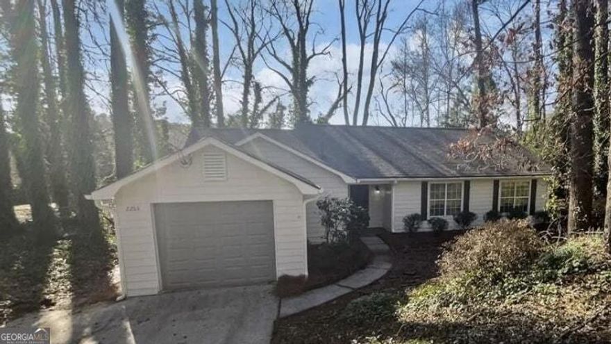 Welcome to this charming 3-bedroom, 2-bath ranch home located in a highly sought-after East Cobb neighborhood with excellent schools! This delightful property combines comfort, style, and convenience, making it the perfect place to call home.  Interior Features: Great Room: The spacious great room features vaulted ceilings and a cozy fireplace, creating a warm and inviting atmosphere. Kitchen: Bright white kitchen cabinets paired with stainless steel appliances make for a modern and functional cooking space. Dining Area: The open dining area seamlessly connects to the great room, offering a perfect layout for entertaining or family meals. Flooring: Easy-to-maintain laminate floors run throughout, adding a touch of elegance and practicality.  Outdoor Living: Patio and Deck: Enjoy outdoor living with a patio and deck, perfect for relaxing or hosting gatherings. Fenced Yard: The fenced backyard boasts a beautiful wooded view, providing both privacy and a serene natural backdrop.  Additional Features: 1-Car Garage: A convenient one-car garage offers storage and parking.  Location: Situated in East Cobb, this home offers proximity to top-rated schools, shopping, dining, and recreational opportunities, making it an unbeatable location for families or professionals.  Don't miss this opportunity to own a beautifully maintained home in a prime area. Schedule your showing today and see all this property has to offer!