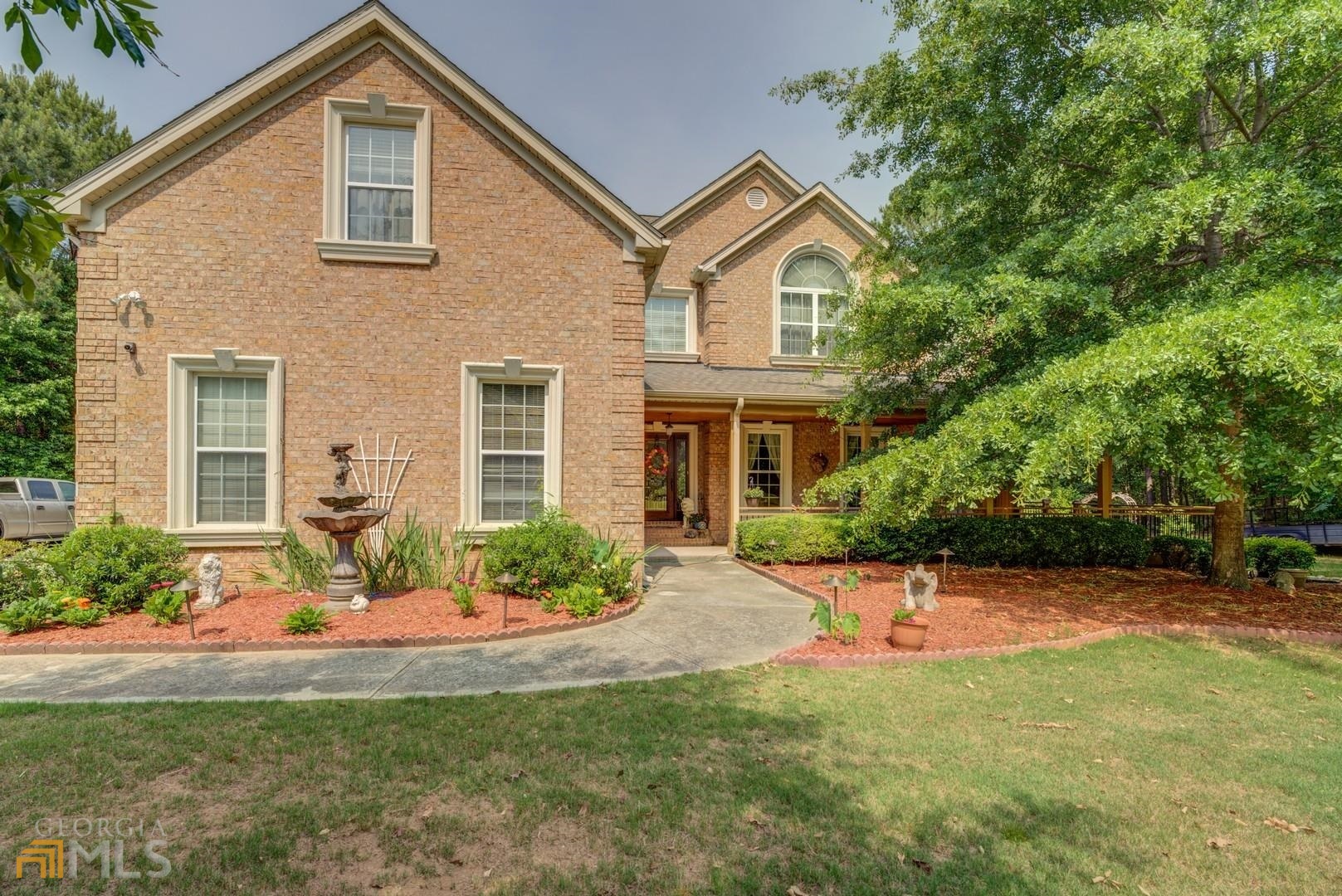 ** COME HOME TO YOUR VERY OWN PRIVATE OASIS**THIS HOUSE IS LARGE ENOUGH TO BRING THE EXTENDED FAMILY WITH ITS FINISHED BASEMENT WITH SECOND KITCHEN - 6 BR 5 BATH 4 SIDED BRICK HOME WITH ALL THE BELLS AND WHISTLES AND OVER 5400 SQ FT- MAIN FLOOR FEATURES TWO STORY FOYER ENTRANCE - HUGE FAMILY ROOM WITH LOTS OF WINDOWS AND NATURAL LIGHT- FORMAL DINING ROOM OFF OF GOURMET KITCHEN WHICH HAS TONS OF CUSTOM CABINETS, GRANITE COUNTER TOPS, TILE BACKSPLASH, STAINLESS STEELE APPLIANCES, ISLAND FOR FOOD PREP, HUGE PANTRY - EAT IN AREA AND OFF OF KITCHEN YOU'LL FIND AN AMAZING KEEPING ROOM WITH IT'S OWN FIREPLACE AND ROOM FOR ENTERTAINING - MAIN FLOOR ALSO FEATURES BEDROOM AND FULL BATH - UPSTAIRS YOU'LL FIND AN HUGE MASTER SUITE WITH FIREPLACE AND ROOM FOR HOME OFFICE OR SITTING AREA - LARGE MASTER BATH WITH DOUBLE VANITIES , SEPARATE SHOWER, SOAKING TUB, WALK IN CLOSET - UPSTAIRS ALSO HAS THREE MORE GOOD SIZE BEDROOMS WITH TWO MORE FULL BATHS - PERFECT FOR HOME OFFICE OR TEEN/INLAW SUITE - DOWNSTAIRS IS A FULL FINISHED BASEMENT WITH BEDROOM, FULL BATH ALONG WITH HUGE FAMILY ROOM THAT ALSO HAS WONDERFUL COVERED AREA GOING OUT TO BACKYARD AND POOL - COVERED PORCH THAT WRAPS AROUND HALF OF HOUSE LARGE ENOUGH FOR SEVERAL TABLES AS WELL AS HOT TUB - BEAUTIFULLY LANDSCAPED YARD AND EVEN HAS A POOL HOUSE WITH BEDROOM, BATH AND LIVING AREA - THIS HOUSE HAS SO MUCH TO OFFER AND TOO MUCH TO LIST - GREAT SCHOOL DISTRICT AND CLOSE TO SHOPPING AND RESTAURANTS