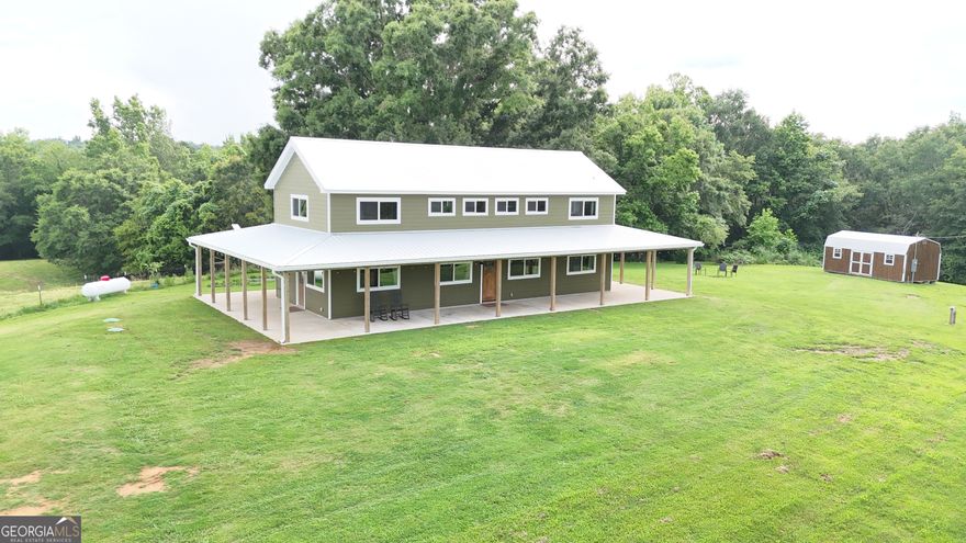 Charming homestead perfectly situated on 26+ acres! This beautiful property features a master bedroom and bathroom on the main floor, guest bathroom and laundry area on the main level, open concept kitchen/living area, 2 guest rooms upstairs, and local rough cut lumber throughout! This mini farm has a barn complete with a fully operational corral/cattle squeeze. Additionally, there is a brand new chicken coop, a hunting stand, and a play set for the kids! If homegrown is your style, you'll love the strawberry raised beds, blueberry bushes, pear trees, pecan trees, fig trees, crab apple trees, muscadines, and raspberry and blackberry bushes. As if that weren't enough, the property is bordered by Falling Creek which has a four wheel drive accessible trail alongside it! You must see it ALL to take it all in!