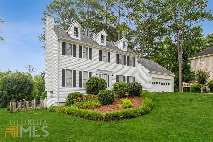 Beautiful traditional home on a quiet culdesac lot in the Brookwood High district. Gleaming hardwoods lead to the generous formal DR, updated chefs kitchen with white cabinets, granite tops, tile floor & splash plus plenty of cabinet & counter space. Eat in area opens to private deck which overlooks the large fenced backyard. Cozy family room with FP and built ins plus half bath on main. Up features owners suite with walk in closet, sunken den or office plus additional 12x9 attic storage room off den. Additional 2 BR & BA up. Basement features den or bedroom plus workshop area. Home located near swim/tennis amenities.
