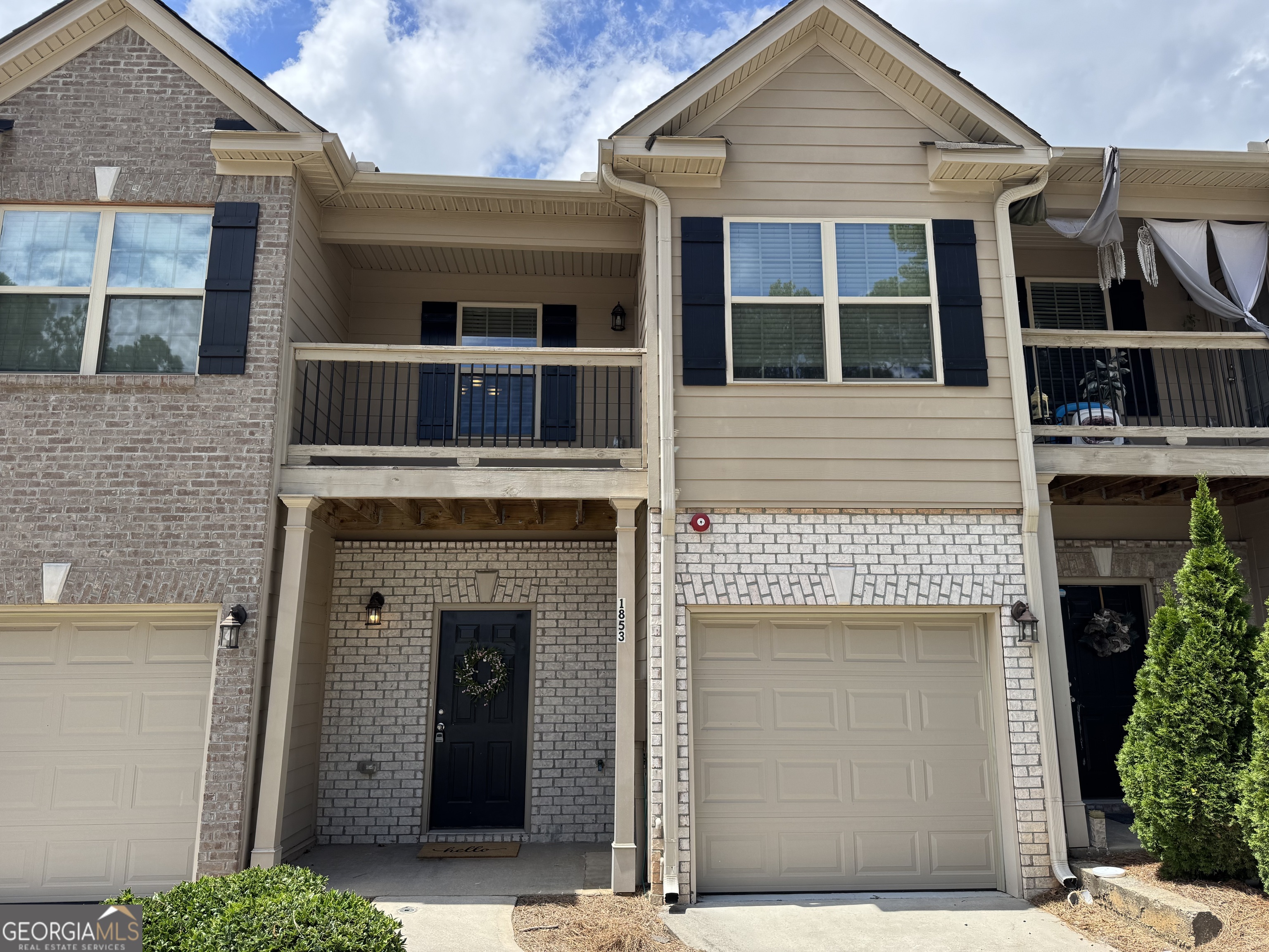 $5K Incentive!! Stylish and modern 3-bedroom, 2.5-bath townhome perfectly located just south of Atlanta. Step into a stunning two-story foyer with a soaring ceiling, elegant staircase, and convenient coat closet by the entry. The spacious family room, complete with a cozy fireplace, flows seamlessly into the fully equipped kitchen featuring espresso shaker cabinets, granite countertops, stainless steel appliances, and a refrigerator included. A convenient half bath is located on the main level. Upstairs, the primary suite boasts a vaulted ceiling with fan, a luxurious ensuite bathroom with double vanities, a beautifully tiled shower, soaking tub, and a walk-in closet. Two additional bedrooms share a full bath, and the laundry room-perfectly situated near all bedrooms-makes chores a breeze. A hallway storage closet adds extra convenience. Wood plank flooring runs throughout the home. Enjoy the attached garage, with additional guest parking right across the street. Surrounded by shopping, dining, and entertainment, and just 5 minutes from Atlanta Airport, this home offers style, comfort, and an unbeatable location. $5,000 Incentive with preferred lender - Agents, see private remarks.