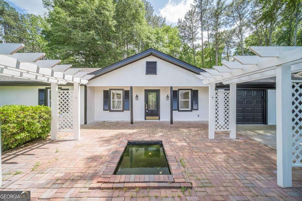 Photo of 4858 Tarleton Drive SW, Lilburn, GA 30047 (MLS # 10785169)