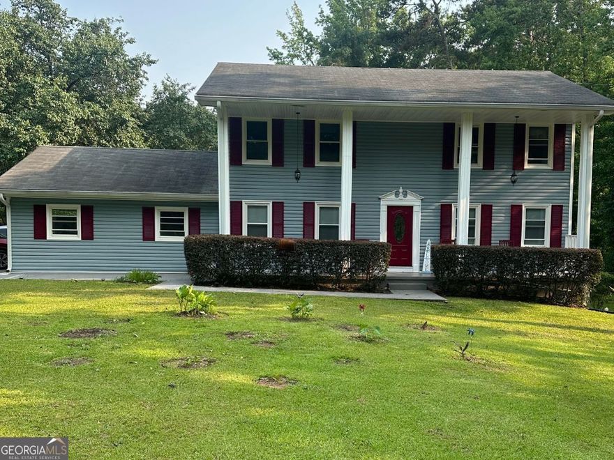 NEWLY UPDATED! Welcome to this beautifully updated 4 bedroom, 2.5 bathroom home on 1.5 acres, complete with an enclosed heated and cooled sunroom, private in-ground pool and NO HOA! When entering the front door, you are greeted with a 2 story foyer. The main level includes separate dining room, den and living room, a large half bath, as well as a huge kitchen, and separate laundry room. Upstairs you will find 4 spacious bedrooms, and 2 full bathrooms. The updates include all new LVP flooring throughout, brand new bathroom vanities, stylish painted kitchen cabinets and new granite countertops, all new paint throughout, brand new water heater, and 2 new outdoor AC units. The level backyard includes a carport and 2 outdoor storage buildings. Septic was just pumped in May 2025, and termite bond was just renewed for another year. Conveniently located to I-75 and all major shopping and restaurants. With all this home has to offer, it won't stay available long! Make this one yours!