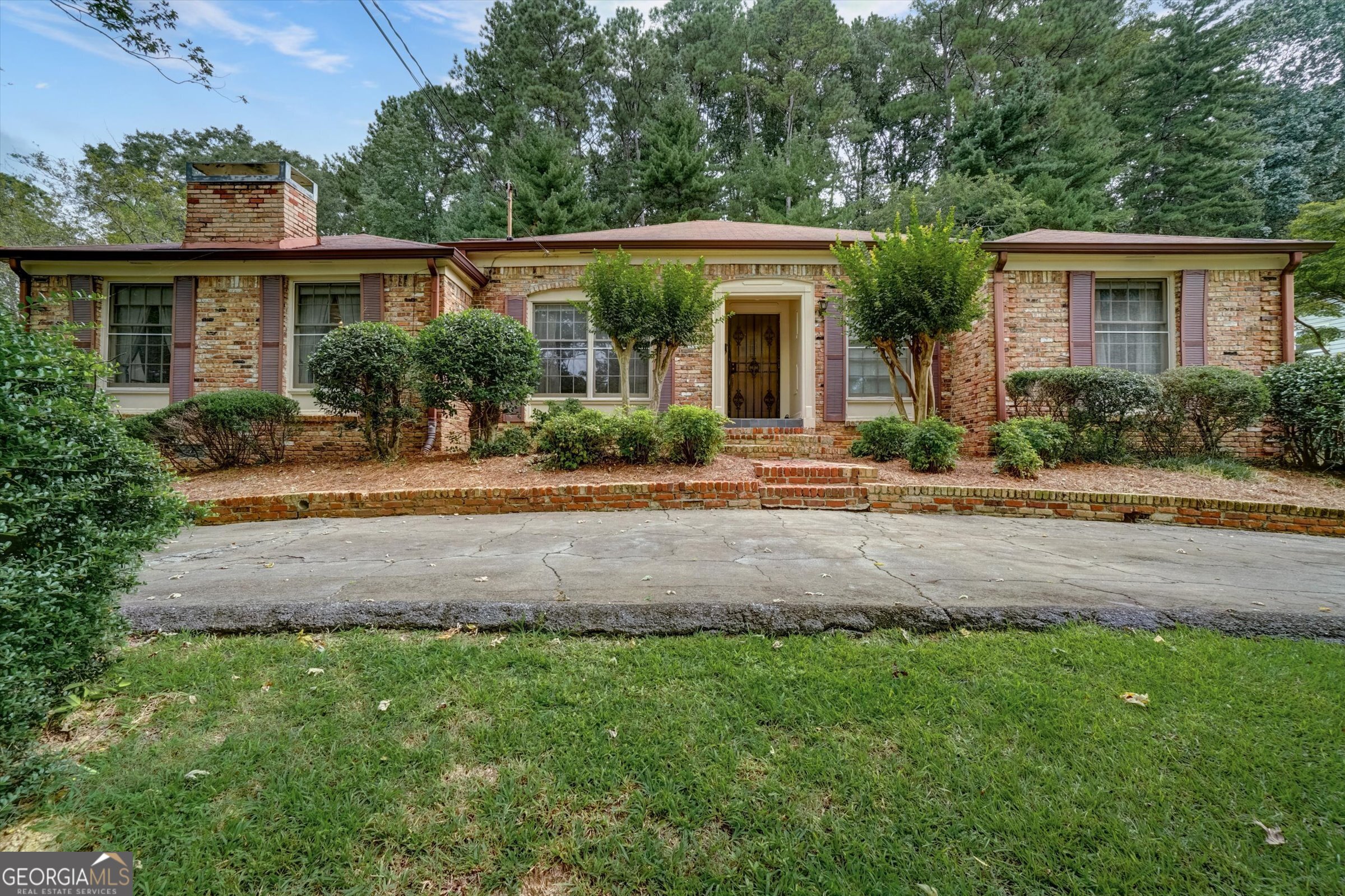 Welcome Home!!! Nestled in the incredibly beautiful Georgetown neighborhood, this full brick ranch offers timeless charm with a large partially finished basement and sparkling swimming pool, recent new garage door, water heater and roof. This 3 bedroom/3 bath home, with just a few more updates, has the potential to become a true designer's dream! Inside, the home is both comfortable and functional. The spacious kitchen provides plenty of cabinetry, while the oversized dining room is perfect for hosting family gatherings and entertaining. A private den, formal living room and built-in bar create multiple spaces to relax and enjoy The bedrooms are generously sized, offering comfort and room to grow. Step outside to enjoy the convenience of Georgetown and Gateway Corner, where you'll find biking paths, scenic walking trails, outdoor recreation, and community amenities just minutes away. The location is unbeatable--close to the exciting new High Street development with its dining and shopping options, as well as easy access to Chamblee, Brookhaven and downtown Atlanta. Also very close to Perimeter Mall.
