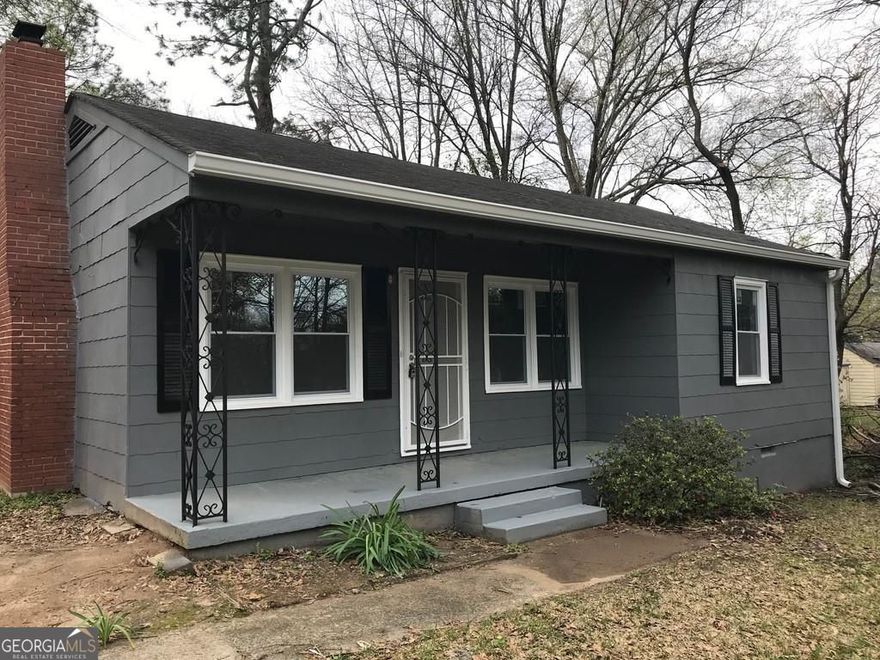 Located at 839 Mimosa Drive, Forest Park, GA, this inviting home in Clayton County offers a wonderful opportunity to embrace comfortable living within a ready-to-move-in residence. The living room is thoughtfully designed around a fireplace, creating a focal point that provides warmth and a cozy atmosphere for relaxation and gatherings. Imagine evenings spent enjoying the gentle glow of the fire, creating a haven from the outside world. With two bedrooms and one bathroom within 797 square feet of living area, this residential property offers a functional layout that maximizes space and comfort. The porch provides a welcoming entry and an ideal spot to enjoy the outdoors. Built in 1967, this home presents a chance to have a piece of Forest Park history, updated for modern living.