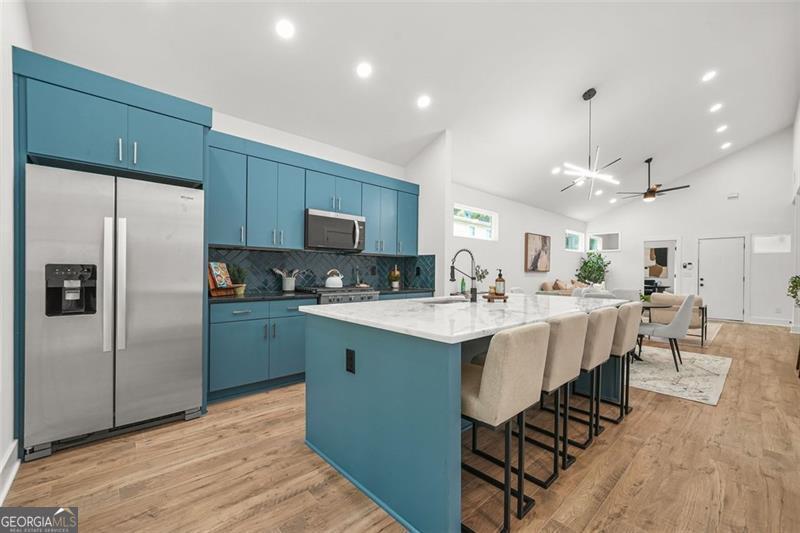 **Purchase for $339,900 if income is $137k or below, annually. Interest rates as low as 6%! Qualifications apply. Call NOW for details. ** Over $45,000 in down payment assistance available, call to see how much you qualify for. Welcome to intown luxury living, for less! Relax after a hard day's work on your covered front porch. Entertain guests in your open concept living and dining room. Enjoy recessed lighting throughout your home. Prepare meals on your solid surface counter tops while enjoying up to three guests at your massive kitchen island. As the afternoon fades, you can relax under your covered rear porch and bird watch from your private backyard. 3 bedrooms and 2 full bathrooms provide plenty of room for resting and flex space. Your master-on-main with oversized rainfall shower and walk-in closet provide plenty of pamper space for mornings. If you work from home, no sweat! Your flexspace provides plenty of privacy for your home office. It doesn't stop here, your new home is conveniently located within 5 minutes of I-20 & 285. Easy access to the Airport. And the exploding Westside Beltline trail! Ponce City Market, Atlantic Station, and Lee+White mixed-use entertainment complexes are a short drive away, loaded with tons of food and entertainment options. All appliances included except washer and dryer. 10-Year Home Warranty included.