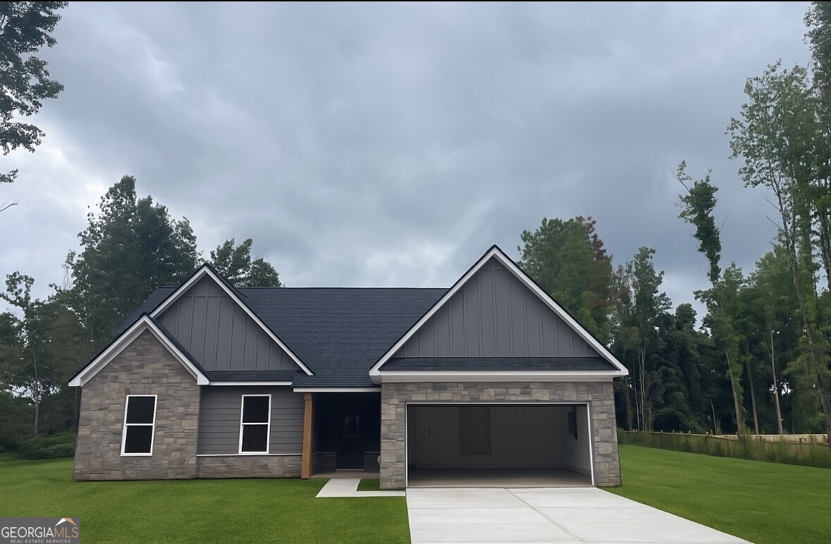 Labor Day Special!! Builder is offering $7500 builder contribution towards closing when using the preferred lender. Charming New Ranch in a Peaceful Neighborhood - 3 Bed, 2.5 Bath Welcome to your dream home! This beautifully designed new ranch offers 3 spacious bedrooms, 2.5 modern bathrooms, and an open-concept layout perfect for comfortable living and entertaining. Located in a quiet, well-established neighborhood, you'll enjoy peace and privacy while being just minutes from local amenities. The bright and airy kitchen features stylish finishes, ample cabinet space, and a large island overlooking the living and dining areas. The primary suite includes a walk-in closet and a spa-like ensuite bath with dual vanities and a walk-in shower. Two additional bedrooms provide flexibility for family, guests, or a home office. Additional highlights include a covered back porch, attached two-car garage, and energy-efficient systems throughout. Whether you're looking to settle down or simply enjoy one-level living in a tranquil setting, this home has it all!