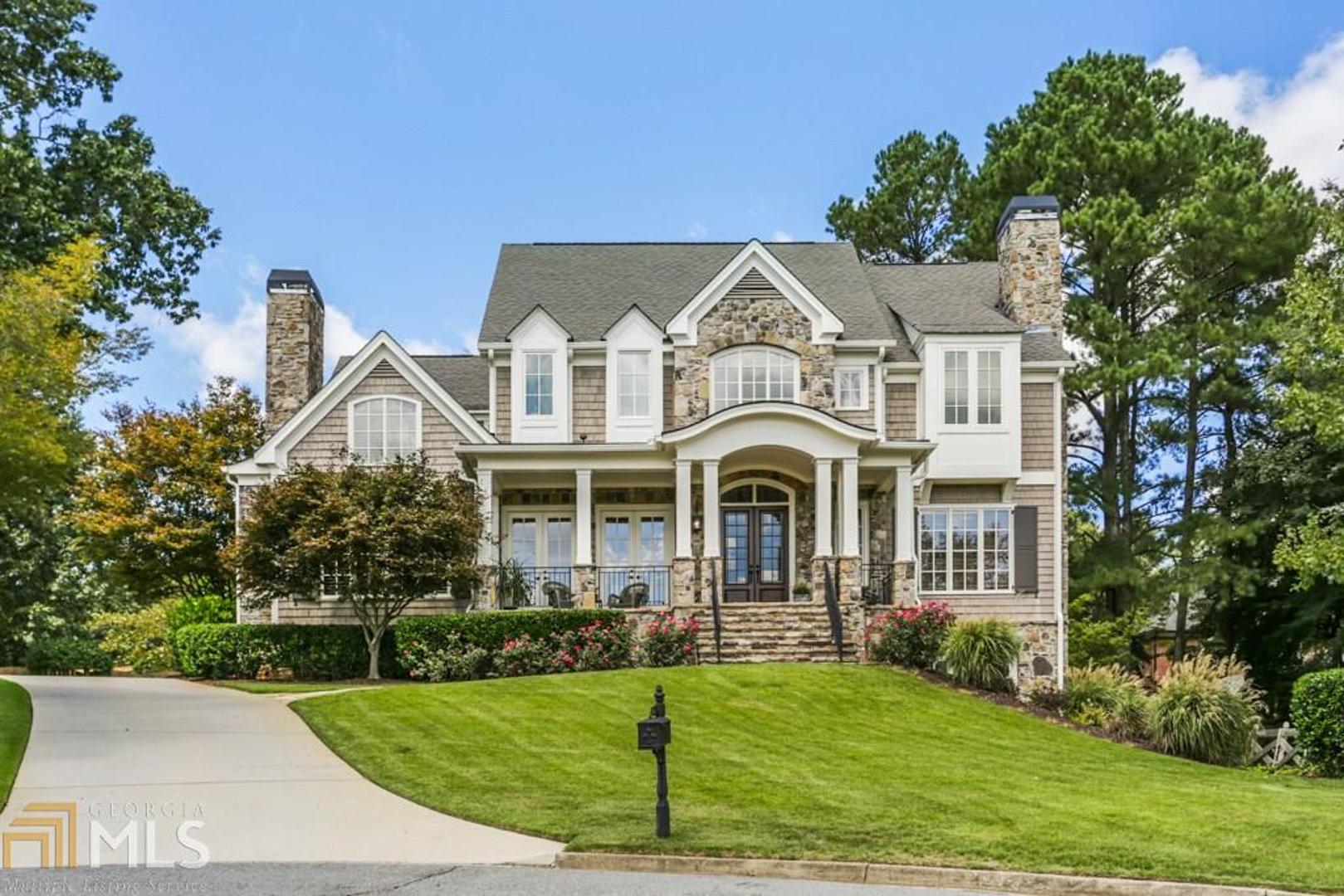 Great Opportunity to get into Rivercliff Swim/Tennis Community in Walton HS district! Superb location - walk to Atlanta Country Club and drive to Sandy Springs in less than 5 minutes!  Built by Panama Properties, this custom home has fantastic curb appeal, a walkout backyard and an amazing view off the front porch of the ridge line over the Chattahoochee River. Large updated kitchen w/ island and bar seating, walk-in pantry, and bfast area. Private study, formal DR, living room, keeping room and guest suite on main. Master suite w/ f/p upstairs plus 2 add'l BR, loft and bonus/3rd BR. Finished terrace level w/ bar, high-end wine cellar, rec area, and full BR/bath.  Beautifully landscaped level backyard with patio and room for a pool. Plans available upon request for pool addition.