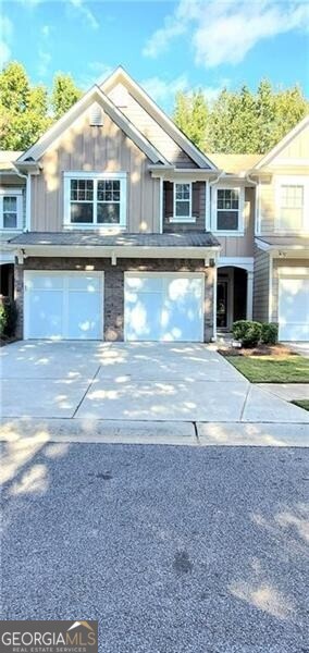 Welcome to a gorgeous townhome available now in the sought after Ellison Lake Townhome community with a LAKE VIEW-RIGHT ACROSS THE STREET! This home has been upgraded and well maintained by the owner and is Fee Simple ownership and offers the lovely feel of a single family home but without the upkeep - the HOA handles all of the lawn maintenance, swimming pool with fun mushroom spray fountain, fitness center, trash collection, water and sewer! Enjoy this array of amenities - easy and convenient living! The main level features a 2-story foyer with 2 display niches, a beautiful chandelier and hardwood stair treads, large fireside great room, open concept dining room, and the kitchen overlooks the great room! Don't miss the large storage closet in the foyer and guest bathroom! Stunning LVP flooring on entire main level, newer light fixtures and 2" blinds! Upgraded fiberglass front door and door to garage with blinds between the glass! Kitchen features granite countertops with stainless steel appliances and an undermount sink and disposal! Refrigerator is included! The dining area features a chair rail, detailed trim and glass doors leading to a private patio! Laundry room is the perfect mud room leading into the kitchen from the garage! Upstairs features an open bonus/loft/flex space-endless possibilities here, all with gorgeous hardwood flooring! The spacious owner's suite features a cathedral ceiling with 2" blinds! The ensuite bath features vaulted ceiling, walk-in closet, double vanity, large soaking tub, separate shower and private water closet! There are 2 additional spacious bedrooms and additional bathroom on this level! Brand new ceramic tiled floors in both bathrooms - stunning! Take note-.New Roof and Water Heater! Don't miss this great home, just minutes to all the amenities of Kennesaw, Acworth and Marietta, including great shopping, restaurants, KSU, Kennesaw Mountain National Park, walking and biking trails! Ellison Lakes offers awesome amenities: Lake, Clubhouse, Fitness Room, Swimming Pool, Playground, Sidewalks.