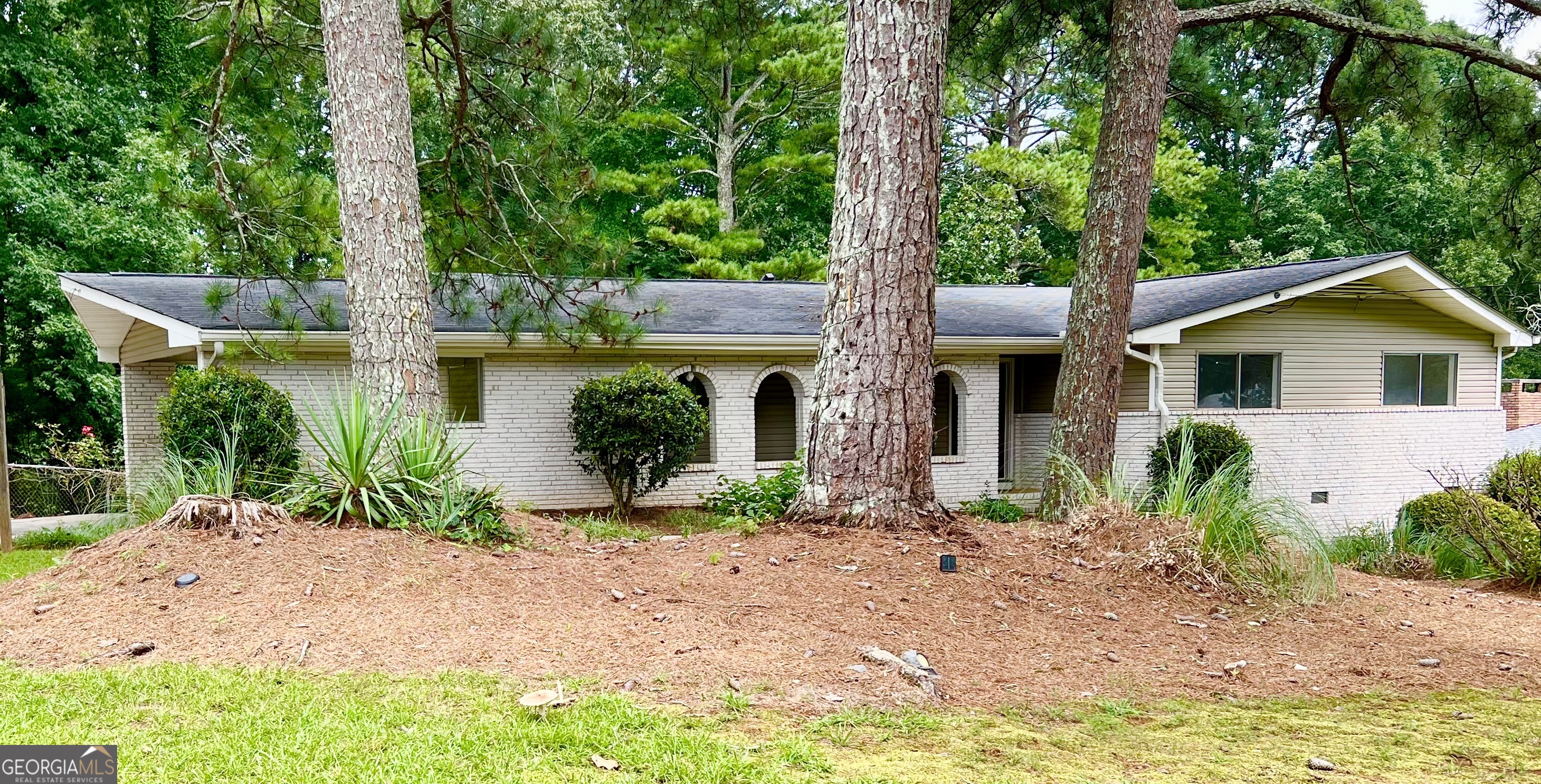 What a location: walk to Livsey Elementary, easy access to I-285 and I-85, AND in a quiet cul de sac neighborhood in Tucker! You're going to love living here! This mid-century(ish) home is the most relaxing and quiet place. There is SO much privacy, natural light and open space here. The floorplan is perfect for roommates with two master suites - one on either end of the house for optimal privacy. The neighborhood is small and is only made-up of 2 cul de sacs - so, no thru traffic. It's lovely and quaint and the neighbors are great, too. More details about this home: 4 bedrooms, 3 full bathrooms, hardwood floors throughout main, adorable kitchen with lots of white shaker cabinets, butcherblock countertops, SS appliances and a breakfast bar with a view into the living room, a fireside keeping / dining room, 1 master suite with vaulted ceiling and 3 closets and separate master suite with 2 large closets and full bathroom, an amazing screened porch overlooking the private and fenced backyard, finished basement with a large bonus room setup that would make a great home office or separate den, extra storage space and laundry also located on the lower level, new HVAC, too! Oh, and landscaping is included! Welcome Home!