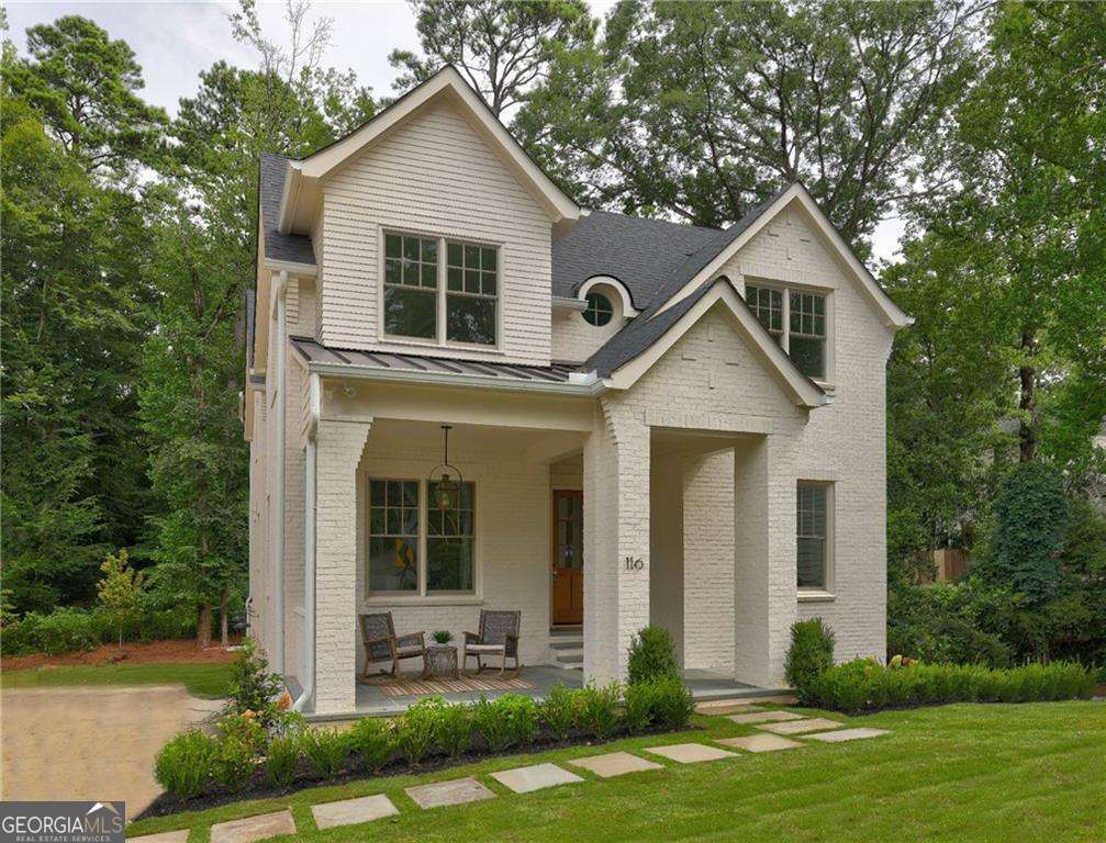 Come see this perfect new home in the heart of Peachtree Hills. Meticulously crafted by Rob Garrison Builders the 4-sides brick 3-story home sits perfectly on a quiet street. The curb appeal is designed to be both classic and striking Co and it delivers. Walking distance to Peachtree Battle shops and restaurants, the Duck Pond Park and Peachtree Hills Park, the 6-bedroom home combines generous light-filled spaces, thoughtful architecture and flow, carefully curated finishes, and a quality and attention to detail. Set on a big lot with a private, level backyard, there is plenty of privacy and room to run. Striking front windows and entrance create a bold statement and invite the light in. The home has both grand and cozy spaces and rooms flow seamlessly throughout the three floors. Main Level: Big covered front slate porch, entry foyer, formal dining room. Stunning chefCOs kitchen w/10ft island, Thermador, and separate sun filled breakfast room. Scullery/butler pantry with beverage fridge and prep sink plus custom shelved walk-in pantry. Huge family room with beamed ceilings and custom limestone fireplace and wall of glass that invites you out to the large rear covered porch with masonry fireplace. Separate study or guest wing on the main level includes a full bath. Upper Level: Spacious primary suite with trey ceilings, a stunning owner's bath and huge dressing area. The wide and bright upper hall leads to three large secondary bedrooms with big closets and two custom fitted baths and a cozy reading or homework nook. The carefully considered laundry layout maximizes storage, light and counter space. Terrace Level: Oversized 2-car drive-under garage with workshop and additional bike/stroller storage space. Mudroom entry with coat closet. 6th private bedroom suite. Giant daylight recreation room with wet bar. Easy wide driveway. Flat backyard with room to spread out and go!