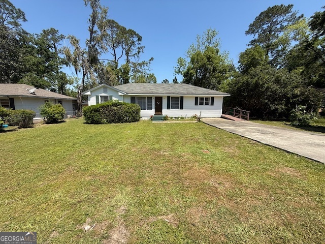 Charming 4 bed 1.5 bath bungalow with too many upgrades to list! New LVP floors, new countertops, appliances, light fixtures, and much more! The plumbing and electrical on the home have been completely upgraded (with warranties) as well as roof and HVAC warranties. Spacious lot with a beautiful patio area for grilling and entertaining. The back yard also boasts a building that could be converted into an in-law suite or she-shed! Walking distance to parks and amenities! Call today for a tour or more information!