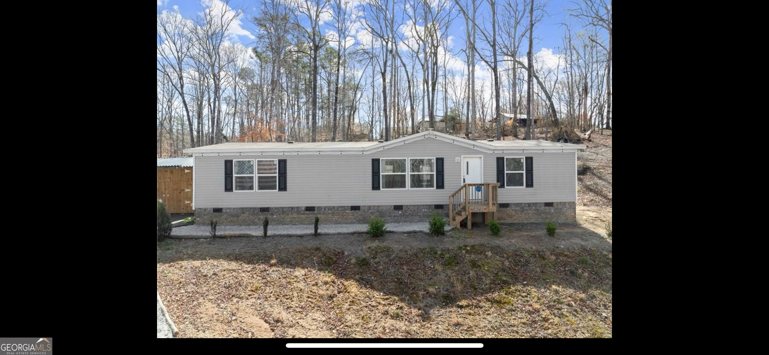 Stunning, Like-New Manufactured Home on a Private, Acre-Plus Lot. Escape to the tranquility of country living in this gorgeous, like new 2022 manufactured home, situated on over an acre of serene, private land in North Hall. This property offers the perfect blend of modern convenience and peaceful seclusion. Home Features: *Spacious & Modern: Step inside and be greeted by an open-concept living space that flows seamlessly into a well-appointed kitchen, perfect for entertaining. *Energy-Efficient: The home is equipped with energy-efficient appliances, including a washer and dryer, helping to keep utility costs down. *Comfort & Convenience: A thoughtful split bedroom floor plan provides privacy for the master suite. *Move-In Ready: Enjoy the added bonus of two mounted TVs already in place. Outdoor & Storage: *The expansive, private lot provides plenty of space for outdoor activities, gardening or simply relaxing. *A large 12x20 detached shed offers an ideal solution for a workshop, extra storage or a dedicated hobby space. Prime Location: Located on a quiet, private road, you're just minutes away from the Lake Lanier Olympic Rowing Center and the beautiful Chattachochee River. The home also offers easy access to the shopping and dining scene on Limestone Parkway, giving you the best of both worlds. This is a rare opportunity to rent a new custom home with exceptional privacy and modern amenities. Don't miss out. Contact us today to schedule a showing.