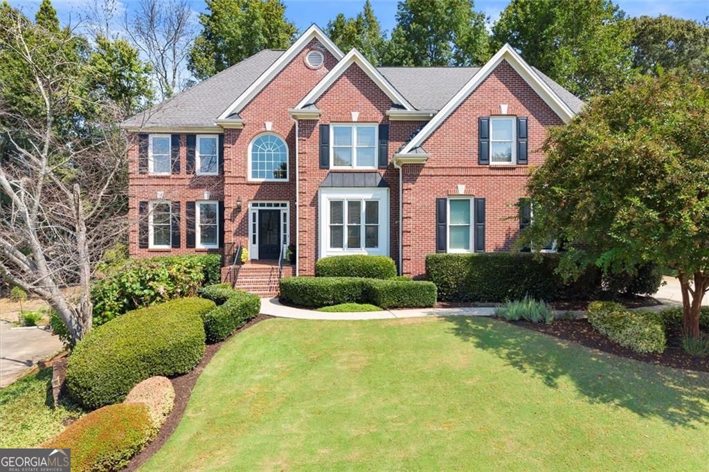 Welcome to 825 Highland Bend Cove, a beautifully designed home offering over 4,800 square feet of living space. Nestled in the desirable Warrenton community, this residence combines classic curb appeal with the space and flexibility today's families need. Inside, the expansive open floor plan provides multiple living and gathering areas, perfect for both entertaining and everyday comfort. The home features generously sized bedrooms, including a luxurious owner's suite with a well-appointed renovated bathroom that balances style and function. The finished square footage allows for versatile spaces such as a home office, media room, or guest space, making it ideal for modern living. One of the true highlights of this home is its seamless indoor-outdoor flow. A bright walk-out sunroom allows easy access to the level backyard, where you'll find a well-appointed outdoor grill and plenty of space for dining, relaxing, or hosting gatherings. This thoughtful layout makes it easy to enjoy Georgia's beautiful seasons year-round. The location is another standout, with walkable access to Waters Road Park and the Alpharetta Greenway, offering trails, greenspace, and outdoor recreation. Within the Warrenton community itself, residents enjoy an active neighborhood lifestyle with amenities including a pool, tennis courts, and a playground. Set on a private lot with mature landscaping, the property offers a peaceful backdrop while still being minutes from top-rated schools, shopping, dining, and all that Alpharetta and Johns Creek have to offer. With its size, location, and neighborhood amenities, 825 Highland Bend Cove is a rare opportunity to own a home that truly has it all.
