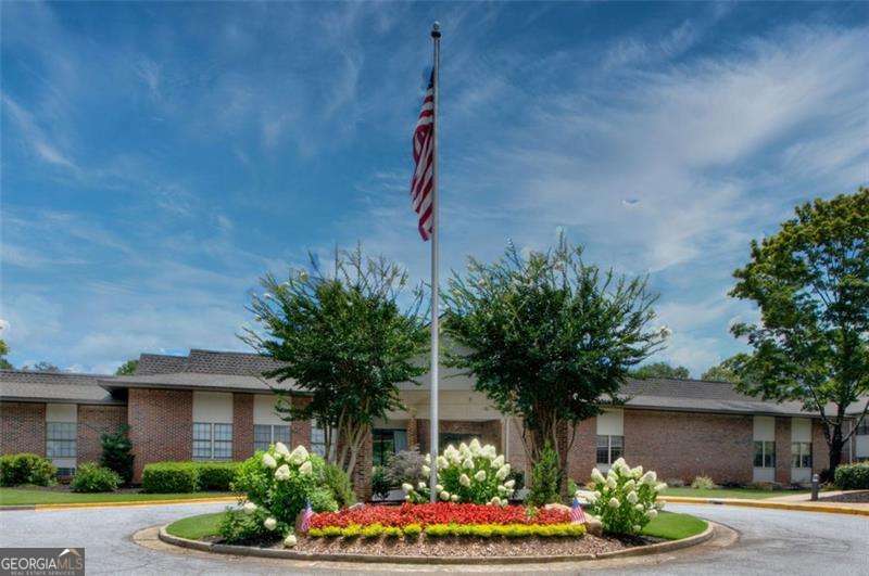 Discover Mount Vernon Village-a hidden treasure nestled in the heart of Sandy Springs. Set on 8 acres of beautifully manicured grounds, this affordable 55+ independent senior living community offers a vibrant lifestyle where retirement feels like a breeze. Surrounded by a warm, inviting atmosphere, residents can enjoy an array of enriching activities and make lasting connections with new friends. Upon entering, you're greeted by a professional, 24/7 Concierge service ready to assist with anything you need. Whether you're here to relax or engage, Mount Vernon Village offers a wealth of activities: from concerts and chair aerobics to travelogues, movies, games & puzzles, arts & crafts, and lively bingo nights. Happy hours, holiday celebrations, and themed card clubs keep the social calendar full. Plus, enjoy group lunch outings, relaxing courtyard gardening, and a variety of events and experiences designed to keep you active and engaged. For added convenience, residents can take advantage of the onsite Salon, scheduled van transportation for shopping, medical appointments, weekly light laundry service, twice monthly cleaning and weekly grocery trips. Offsite outings are also available, ensuring that there's always something to look forward to. The community's prime location places you close to notable landmarks such as Emory & Northside Hospitals, the Sandy Springs Public Library, the Sandy Springs Performing Arts Center (featuring concerts, musicals, and plays), City Green's outdoor concerts, and the Heritage Sandy Springs Museum and concert series. Pet lovers will be pleased to know that small pets (20 lbs or less) are welcome in first-floor units, ensuring your furry companion can enjoy your new home too. The monthly fees include a daily continental breakfast and dinner served in the elegant dining room, access to the charming Rocking Chair Front Porch, and full use of the Exercise Room, Card & Game Room, and the Egyptian Room for private meetings. Additionally, guests can enjoy the Media/Movie Room, Artistry Salon and coin-operated laundry room. along with abundant on-site parking and utilities (excluding phone and cable TV). This move-in ready first-floor condo features beautiful views of the landscaped grounds from a private patio. Inside, you'll find a spacious open-concept living and dining area, complete with a full kitchen featuring sleek granite countertops, luxury vinyl flooring, and a huge walk-in closet. Freshly painted and designed with comfort in mind, this condo offers the perfect blend of style and practicality. For more information, visit the Mount Vernon Village website and discover all that this exceptional community has to offer