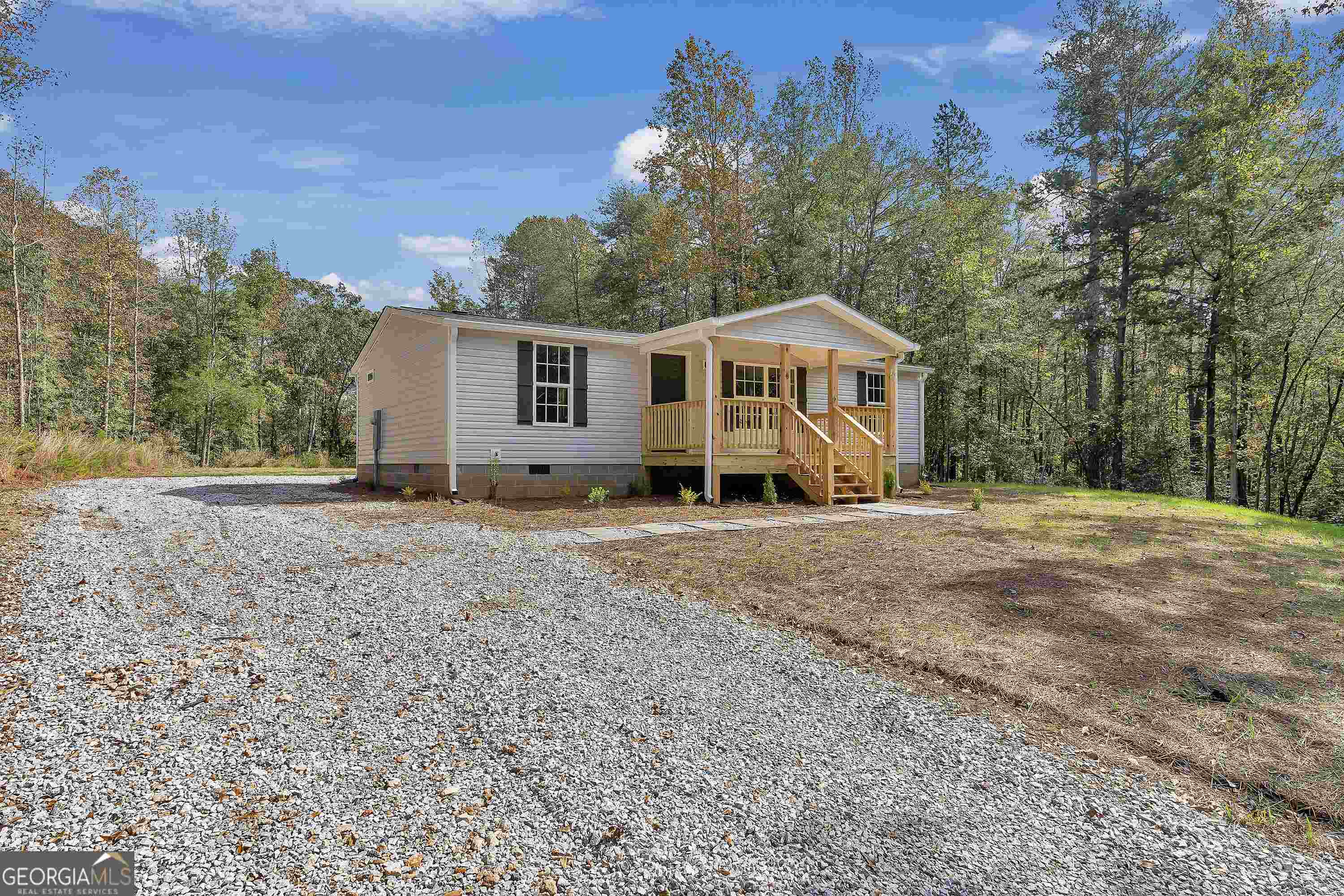 Rare Find! Newley remodeled home from ground up. This property is like new. the exterior features nice private acreage with 7 plus acres, gated drive and nice covered front porch and large rear deck. The interior has brand new custom built cabinets with new countertops. All new appliances, floors, paint, HVAC, water heater and more. If this property is in your budget, dont miss this one! Title has been retired and home has permanent foundation.