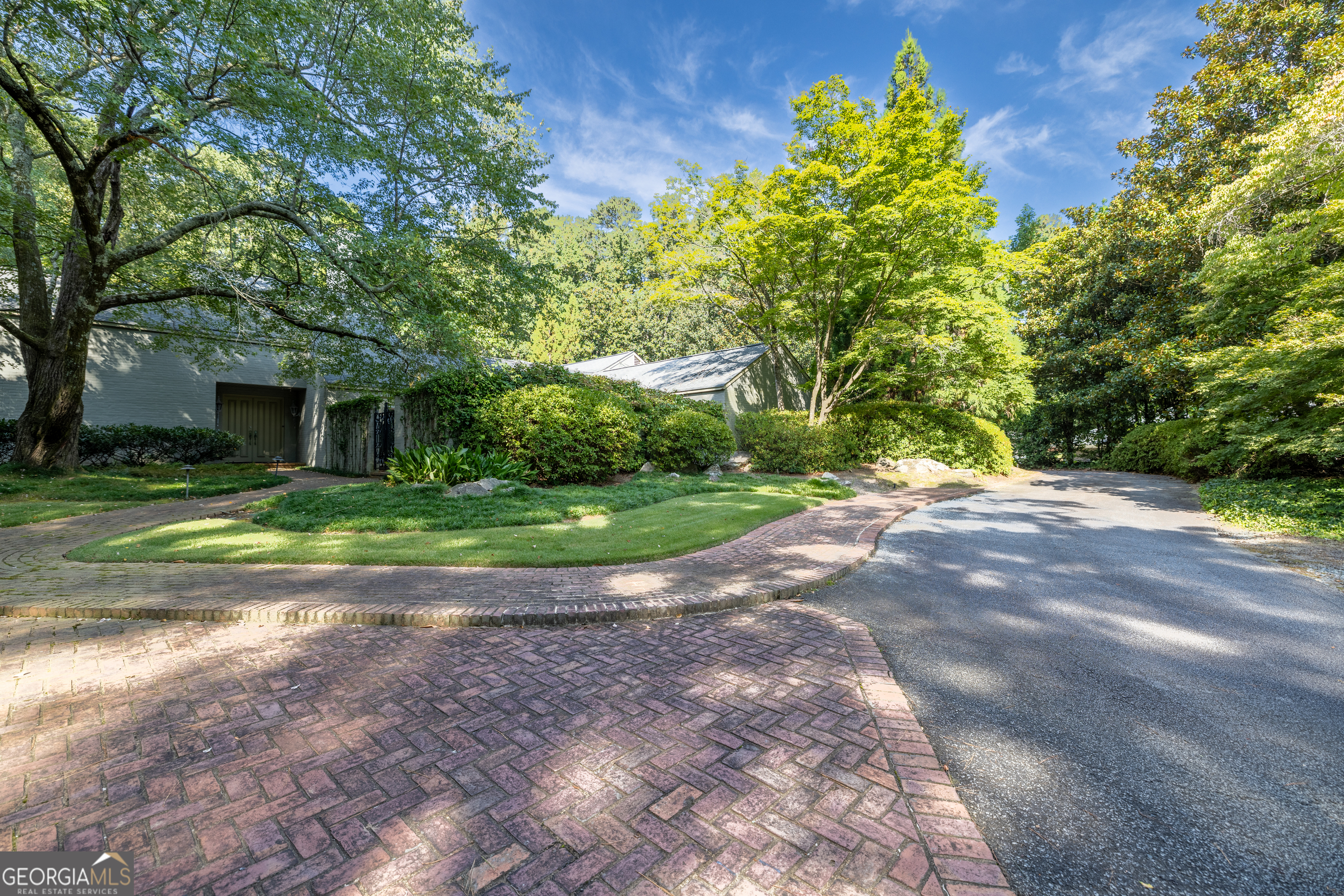 Welcome to an exceptionally designed home at 6150 Riverwood Drive. The main level is perfect for both daily living and entertaining, featuring a welcoming foyer, a spacious living room with a wall of windows, a formal dining room, and a family room with a gorgeous fireplace and another wall of windows. This level also includes a renovated kitchen with quartz countertops, subway tile, and stainless steel appliances, a laundry room, an office/library, and two half baths. The residence offers a thoughtful layout with the convenience of the primary suite and primary bathroom located on the first level. Upstairs, you'll find three additional bedrooms and two full baths. The terrace level offers even more living space, featuring an additional room, a bar with a sink, a space for a refrigerator, as well as an extra bedroom and a full bathroom. The property is situated on a sprawling 1.72-acre lot, with a beautiful and tranquil yard that serves as a private outdoor retreat. The outdoor space is perfect for entertaining, with two courtyards, two screened-in porches, a sparkling gunite pool, a fully fenced yard, and a shed. Don't miss the opportunity to own this exceptional property in a sought-after location.