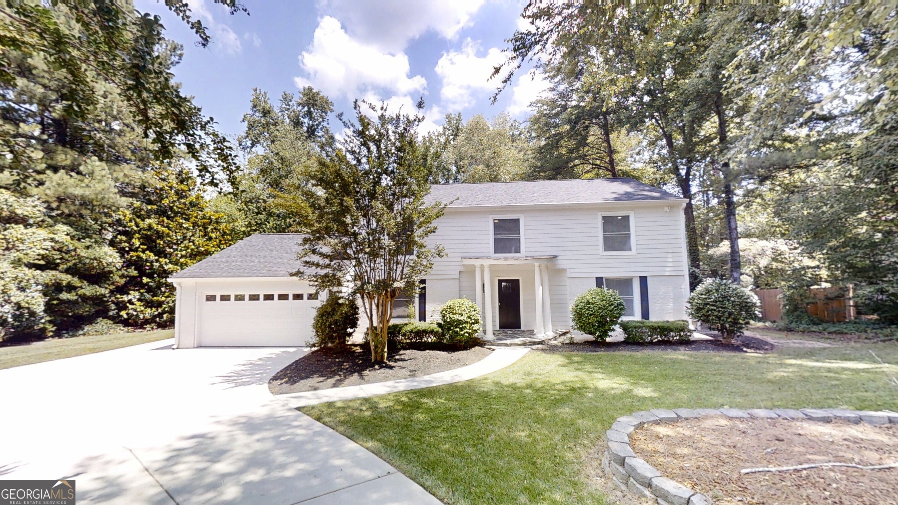 Welcome to this beautifully renovated 4-bedroom, 2.5-bath home in the sought-after Fox Hills neighborhood. Gleaming hardwood floors flow throughout the entire home, with the exception of durable LVP in the hallway leading to the garage, half bath, and laundry room, and classic tile in the upstairs bathrooms. The spacious kitchen is a chef's dream, featuring elegant quartz countertops, stylish white perimeter cabinets, a striking blue island with additional storage, and stainless steel appliances including a built-in wine cooler perfect for entertaining. Retreat to the generous primary suite with a luxurious en-suite bath showcasing a large, beautifully tiled shower. Enjoy morning coffee or evening relaxation on the private rear deck or in the separate screened-in porch, ideal for year-round gatherings. Meticulously landscaped front yard enhances curb appeal, while the home's prime location offers access to top-rated schools and convenient amenities. Don't miss the opportunity to call this exceptional property your home!