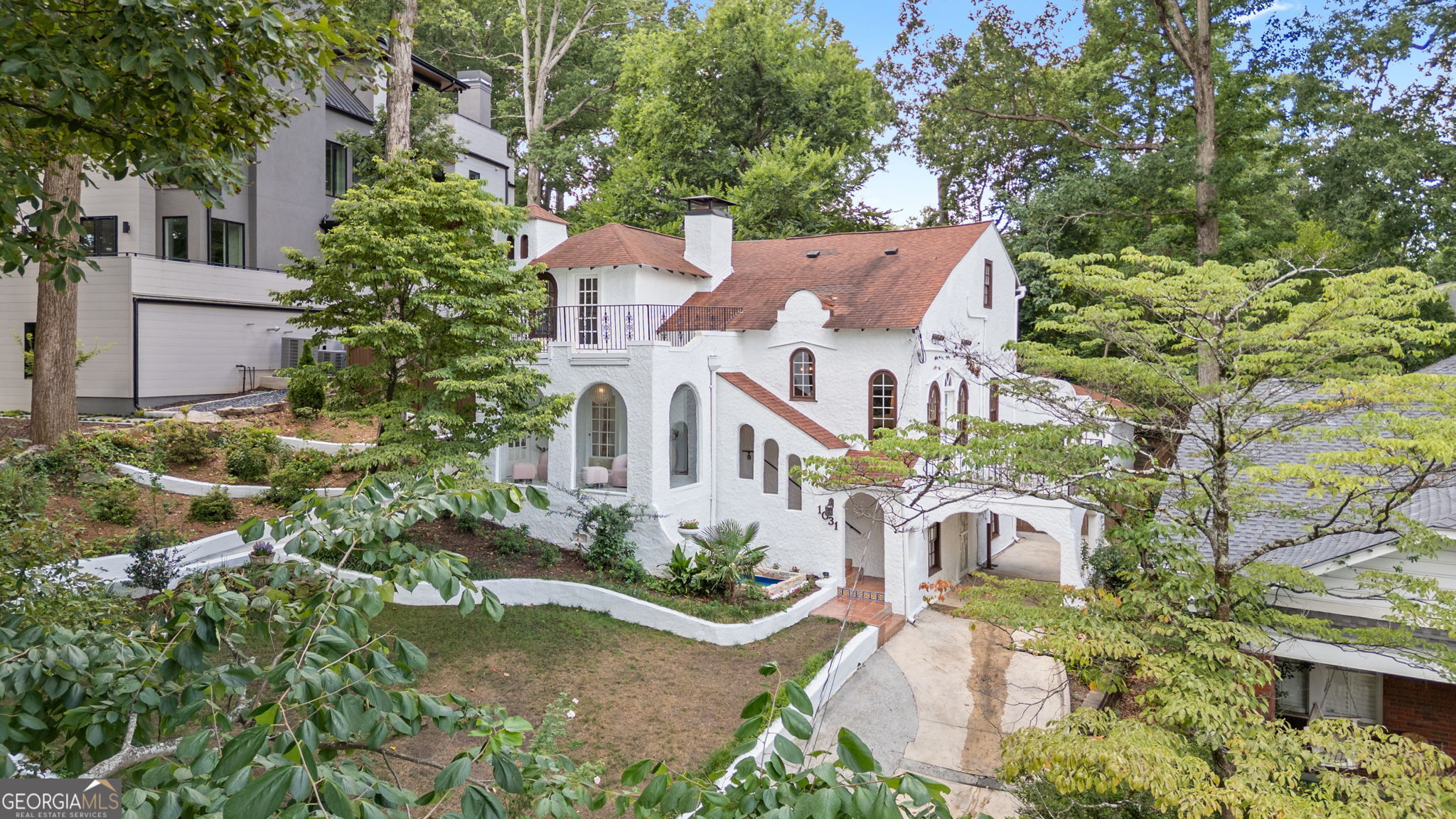 Charming Spanish-Style Home in Desirable Morningside. Discover elegant living in this stunning 1925 Spanish-style home featuring 4 spacious bedrooms and 3 beautifully appointed bathrooms. Don't miss the hand painted Talavera and terracotta tile on the exterior entrance staircase. Nestled in the heart of Morningside, this property combines classic charm with modern upgrades. Owners recently had the interior and exterior plaster restored with Vasari Carerra plaster. Step into a beautifully landscaped backyard complemented by exquisite Pennsylvania 36" bluestone stepping stones, perfect for entertaining or relaxing in nature. The front walkway is enhanced with luxurious Italian porcelain stone tile, offering a welcoming entrance. The grand living room boast 18" pecky cypress ceiling along with an oversized Moroccan style mantle fireplace. The kitchen boasts elegant tile from Merola Spain along with sophisticated chef inspired appliances that include custom walnut panels for the Bosh Benchmark refrigerator and Wolf range. The sunroom features generous 18-inch satin ceramic tile for that bright, open feel. Enjoy the beauty of white Calacatta matte recycled glass marble tile on the upstairs guest room patio. You will love the spa like primary bath featuring Calacatta gold countertops, pedestal tub, hand glazed Cle zellige tile, circa lighting, and a French Art Deco light from circa 1930. Newly added custom California closets in the primary and laundry rooms. A recently stained (Benjamin Moore Tutor Brown) deck provides the perfect outdoor retreat, surrounded by a freshly painted fence (Sherwin-Williams Rain Refresh lodge brown) ensuring privacy and style. Don't miss this opportunity to own a piece of Morningside history infused with modern luxury. Schedule your private showing today!