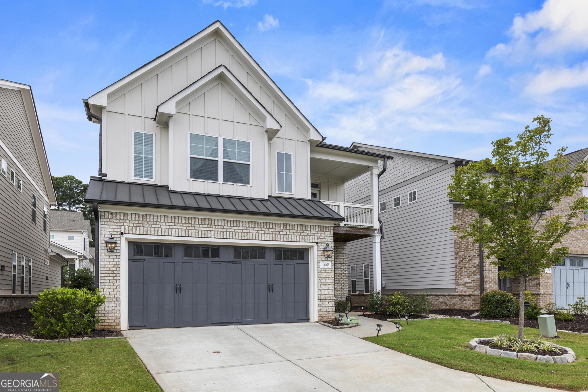 Welcome to Promenade at the Square! Just a short walk or drive from Marietta Square, 558 Onyx Landing sits in a desirable neighborhood adjacent to City Club Marietta! Built in 2020 with its original owners, this Whitney floor plan offers added privacy, stunning Kennesaw Mountain views, and easy access to City Club Marietta Golf Course. Inside, the bright, open-concept main level features a foyer, formal dining room, spacious living area, powder room, front and back balcony and modern kitchen with a cozy breakfast nook. Step outside to a newly turfed backyard with a private patio, mini putting green, and sitting area! Upstairs, the luxurious primary suite boasts a beautifully designed bath and his-and-hers closets. Three additional bedrooms include one with an en-suite bath, plus another double-vanity bathroom. Ample storage is available with a spacious attic and generous closets throughout. As part of the original section of the neighborhood, this home includes access to the community pool, with yard maintenance covered by the affordably-priced HOA. Don't miss this exceptional home in a prime location! Listing Agent 1 resides in the neighborhood and has been here since the beginning of construction and knows the neighborhood the best, so please reach out if you have any questions!