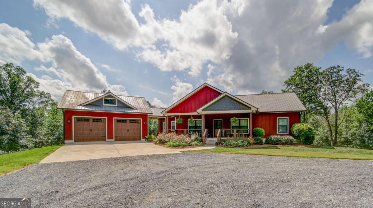 Welcome home! Enjoy serine privacy on your 11 acre private estate. 4 bed 3 bath RANCH home on a full finished basement with a detached 2 car garage! Rocking chair front porch invites you inside the living room with stacked stone fireplace, gas logs and flagstone hearth, opens to the bright kitchen with granite c-tops, oversized 42' island, large pantry, stainless appliances, custom wood cabinets with soft close doors & drawers, also opens to the breakfast room and covered back porch. From the detached garage you'll enter into the mudroom which leads you to the laundry room, separate grilling/smoker porch, and into the living room & kitchen! Master on main with oversized master bath w walk in shower and separate vanities, additional bed and full bath on main, head down to the finished basement where you'll find the rec room, 2 additional bedrooms, 1 full bath, unfinished extra storage space w dual water heaters and storage shelves. Step outside where you'll find the 'Generac' power generator, Commercial style Chicken coop for fresh eggs and complete privacy!!! Too much too list! Must see! ** Property is under conservation tax break with 5 years left***