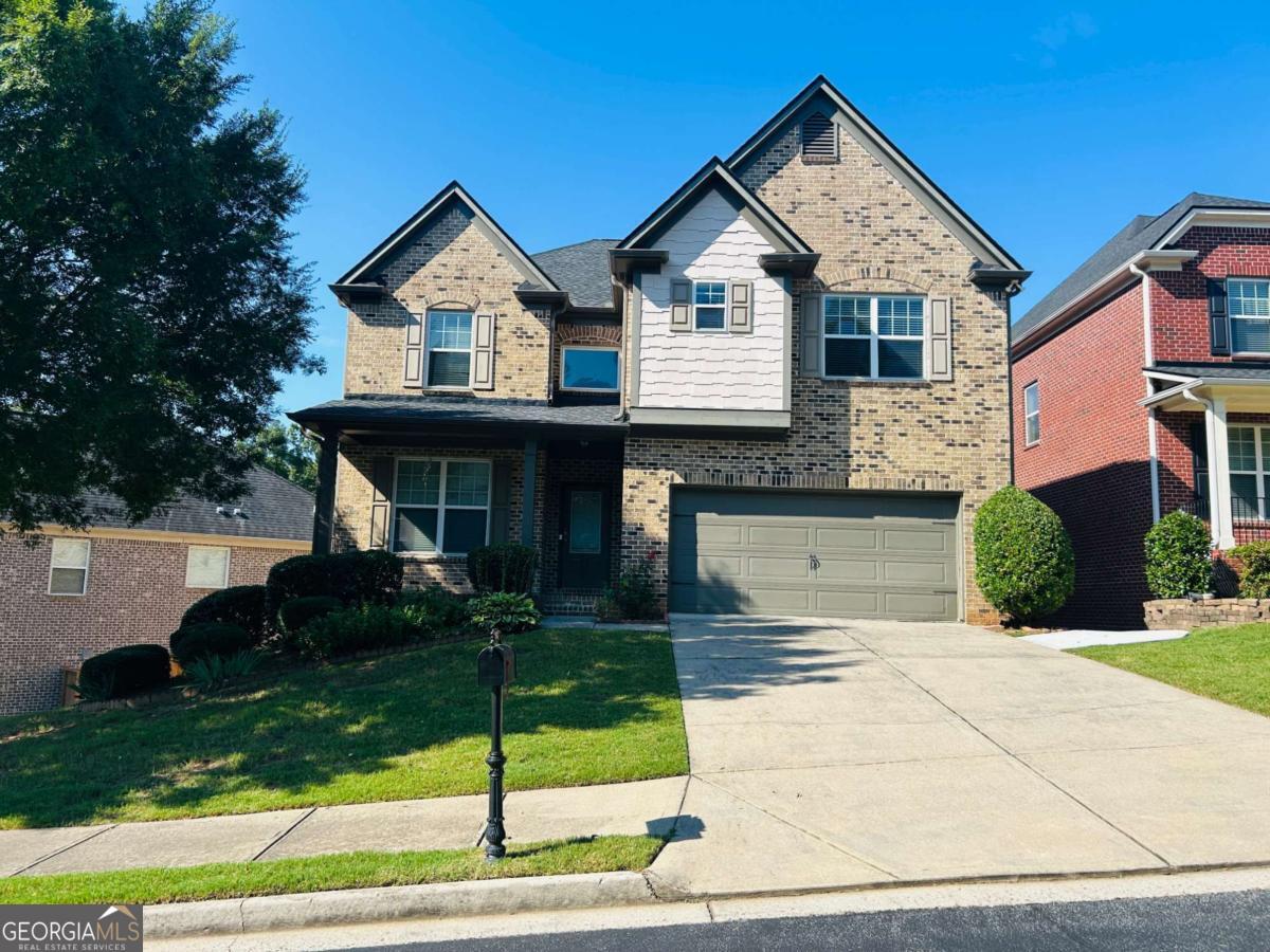 Welcome to this stunning 5-bedroom, 4-bathroom home located in the desirable gated community of Autry Township. This property offers a spacious layout with plenty of room for everyone. As you enter you are greeted with beautiful hardwood floors, a formal dining room, open floor plan family room and eat in kitchen! The kitchen features a large island, plenty of cabinets, granite countertops and SS appliances! Off the family room is one of your 2 covered balconies! Upstairs up will find the primary suite, the laundry room and 3 additional bedrooms. The HUGE primary suite showcases a French door entrance, a private covered balcony, large sitting area and a luxurious bathroom! All of the secondary bedrooms are ample in size and have plenty of natural light! Lawn maintenance is maintained by the HOA! This home is located minutes from North Point Mall, Ameris Bank Amphitheatre, plenty of shopping, restaurants and so much more! Experience the comfort and convenience of living in this beautiful home in Johns Creek.