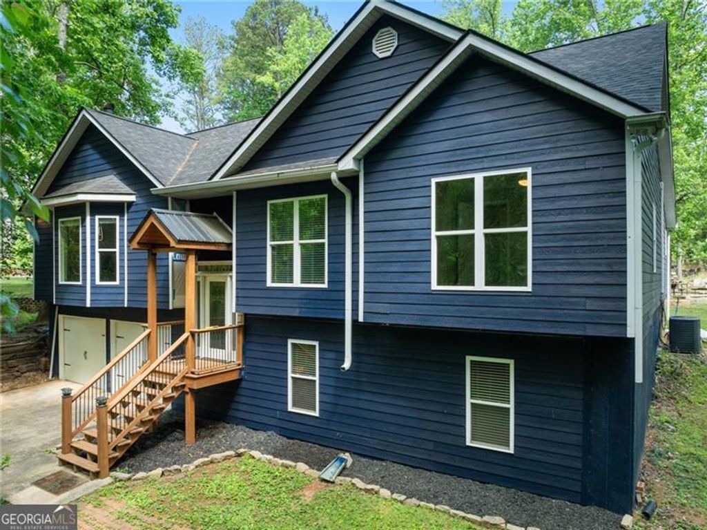 Photo of 7095 Cogburn Road, Cumming, GA 30028 (MLS # 10765277)