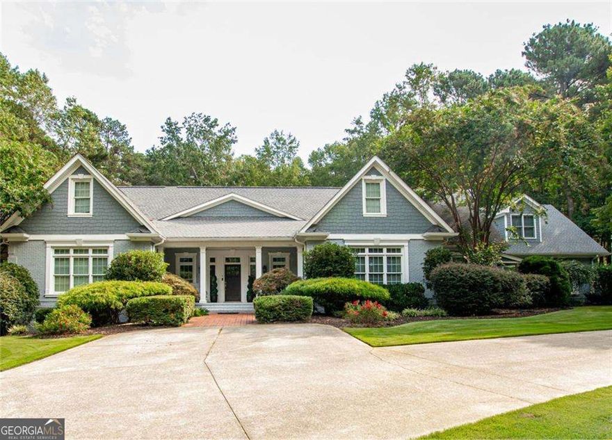 Stunning all-brick estate nestled on a private 2.64-acre lot in Buford, GA. This elegant home boasts 6 spacious bedrooms and 7 luxurious bathrooms with thoughtfully designed living space. This home has a central vacuum for ease and convenience. Main level features a grand Master Suite with heated master bath floor and soaking tub separated from the walk-in shower. An additional bedroom with a private bath on the main level perfect for guests. The gourmet kitchen features stone countertops and stainless-steel appliances with a view to the grand family area. Upstairs, you'll find three generously sized bedrooms, a finished loft area, and ample space for customization. Kickstart a healthier lifestyle with the weight room perfect for strength training, cardio, and everything in between. Relax and feel the fresh air on the back deck overlooking the large backyard. The terrace level is an entertainer's dream, complete with a bar, recreation area, and an additional bedroom and bath with steamed shower. Large windows along back of home for great views of back yard and pool. Step outside to your personal oasis/ pool, featuring a sparkling pool with a cozy outdoor fireplace and an eating area overlooking the pool area. The property is fully gated, offering unparalleled privacy and security, while still being conveniently located close to Mall of Georgia as well as multiple private and public schools. Close proximity to I985 and within one mile of I85 This exceptional home combines timeless elegance with modern amenities, making it a true gem. Don't miss the opportunity to make this your forever home! Book a showing now!