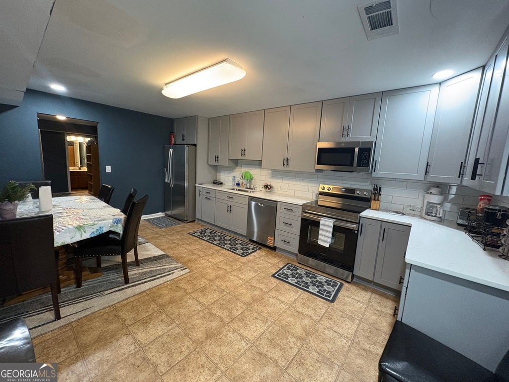 Photo of 180 Village Green Court SW #B, Lilburn, GA 30047 (MLS # 10807362)