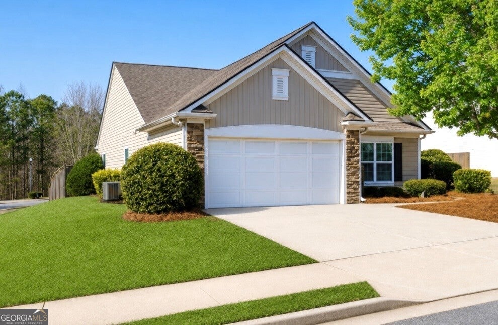 Photo of 312 Woodland Pass, Canton, GA 30114 (MLS # 10803318)