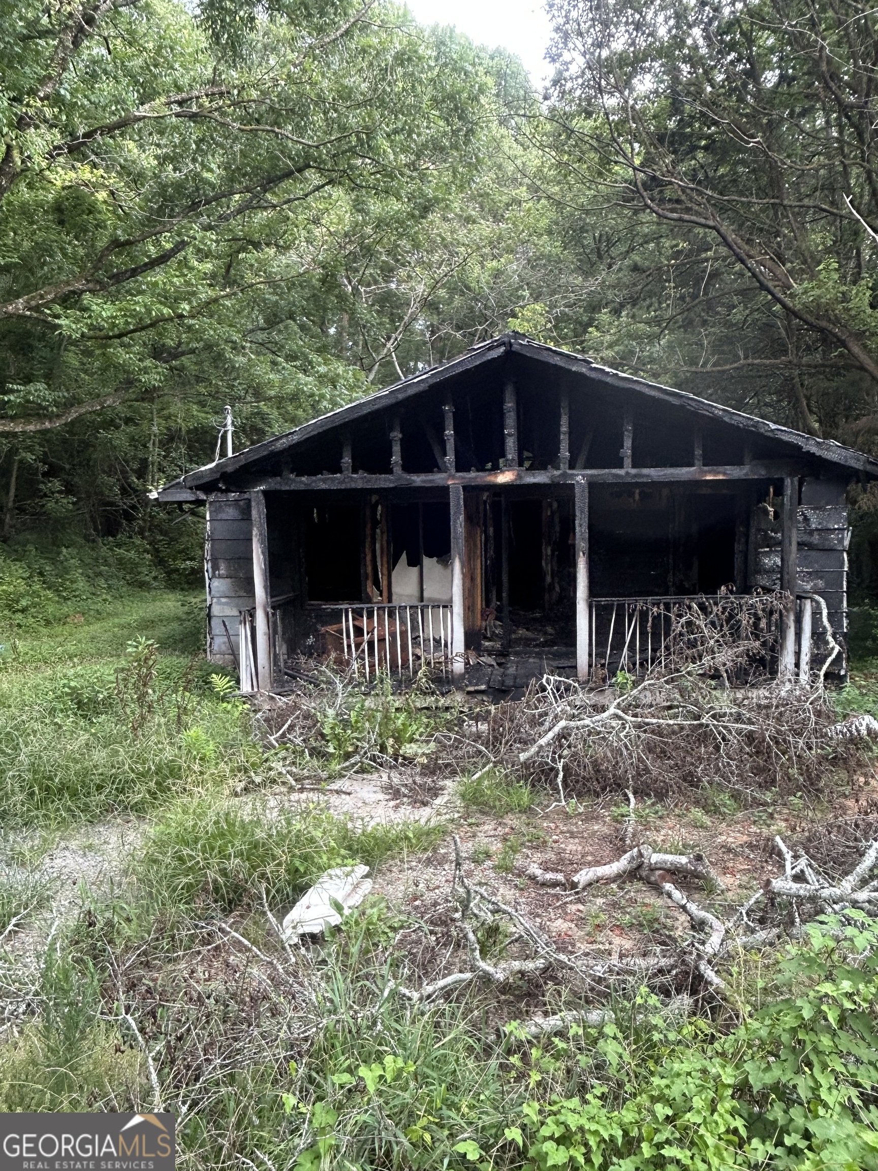 Investor/Builder Special! This 4-bedroom, 2-bath home has experienced fire damage but offers incredible potential for the right buyer. Located in a desirable and well-established neighborhood, this property is ideal for a full renovation or custom rebuild. Some areas of the structure may be salvageable, giving you a valuable head start on your next project. Great layout, and solid location make this a rare opportunity to restore or reimagine a home to your exact specifications. Sold as-is - bring your vision and seize the chance to create something amazing!