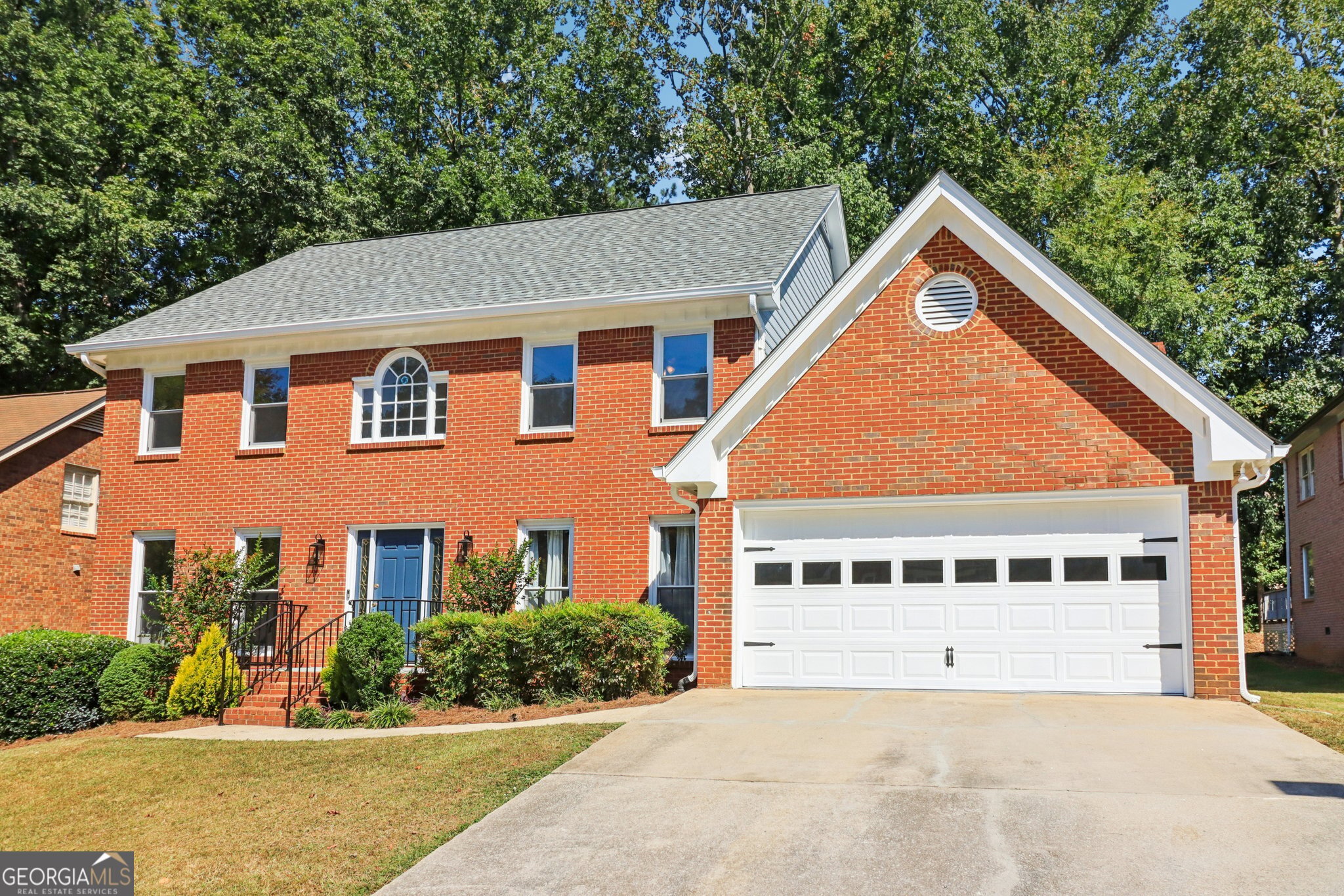 Four-sides brick home with low-maintenance flooring on main and new carpet upstairs. Updated throughout with new HVAC, roof, windows and gutter guards. Bright eat-in kitchen overlooks private backyard. Bedroom suite with full bath on main level plus spacious primary suite upstairs with separate shower and soaking tub. Large secondary bedrooms, lots of natural light. Convenient, stylish, and ready to move right in!