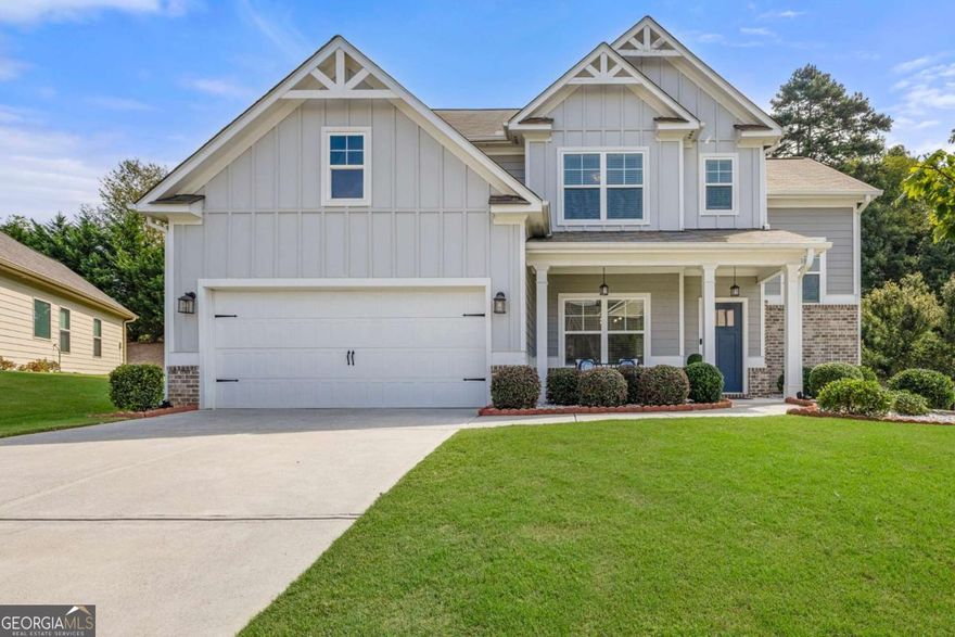 This stunning impeccably maintained home is located in the popular Lakes at Franklin Goldmine and sought-after highly desirable West Forsyth High School district. Step in from the covered front porch with a seating area into bright foyer that leads to the sun field formal dinning room with modern paneling and high end lightning. Open concept kitchen and living space features include LVP floors, white cabinetry, stone countertops, stainless steel appliances, walk in pantry and kitchen island. The family room with fireplace is perfect for family nights, entertaining guests or simply relaxing. Beautiful hardwood steps will take you to the second floor that feature a spacious Master bedroom with tray ceiling, en-suite bathroom with double vanities, large shower with dry area and walk in closet with built ins with drawers , shelves and hanging rods. In addition to master suite, 3 secondary bedrooms, each with walk in closets are spacious for kids or guests. Secondary full bathroom comes with shower/ tub combo and double vanity. Laundry room is conveniently located on the second floor. Outdoor with covered patio, ceiling lights and overlooking private backyard feels like a oasis that you can enjoy anytime of the year.   The Lake at Franklin Goldmine is a wonderful community with swim, tennis and playground. Conveniently located near great schools, shoppings, and dinning. Low Forsyth County taxes are like a cherry on top.