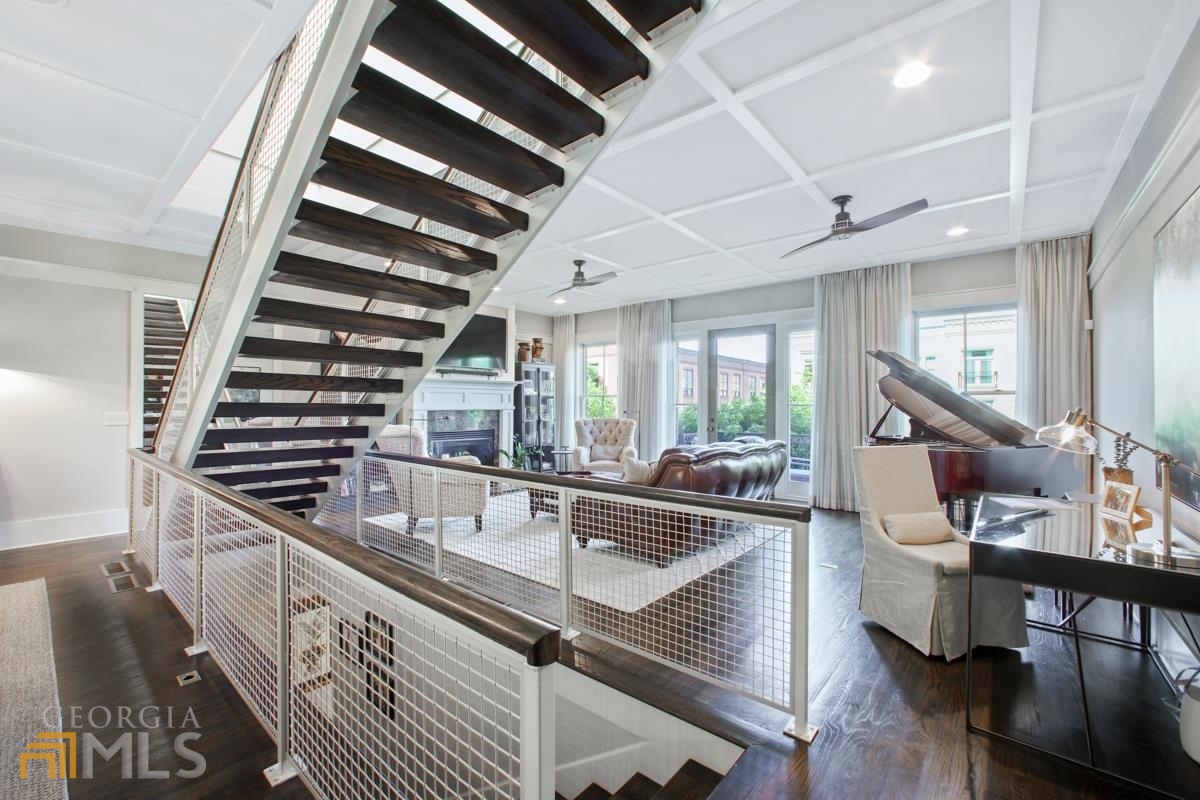 Gorgeous contemporary townhouse in the heart of Glenwood Park directly overlooking the Square. This home is flooded with natural light from the oversized windows throughout, and the skylights draping over the floating staircase. The custom master-suite featured in TV commercials with views of the Atlanta Skyline will leave you in awe. This is the ultimate Live-Walk-Work. The first level of the unit can be used as a storefront or an additional bedroom. To just name a few, you're walking distance to Vickery's Bar & Grill, Drip Coffee Shop, Snap Fitness, Chick-Fil-A, Intown Pediatric, Kroger, Great Clips, and The Beverly.