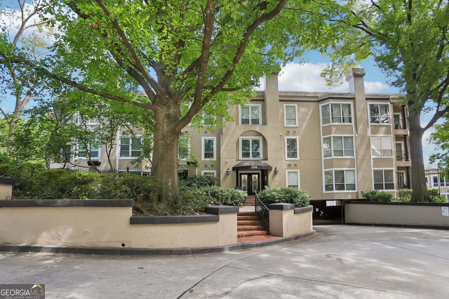 See the difference between "ho hum" and WOW! Much desired private patio, large enough for quiet dining or large party, sets #105 apart from all other Midtown condos. This stunning home has all the updates a professional desires + the charm of being in an established building. All new white kitchen with quartz countertops, deluxe appliances, pantry, and breakfast bar leads to open living room with gas fireplace, hardwood floors and floor to ceiling windows. Roommate floor plan with an oversized bedroom with automatic shades and walk in closet. Both bathrooms are updated. Tandem parking for 2 cars + extra storage cage in basement are included. You can enjoy the pool, clubhouse and gym on a daily basis. 14th ST is an unbeatable location in the Heart of vibrant Midtown with the serenity of the Park on one side + the energy of the Arts District on the other. Enjoy walking to an array of local restaurants, many events at Piedmont Park, the Beltline, the Arts Center, and Marta-offering direct access to the airport in just 24 minutes. You'll love calling #105 your home!