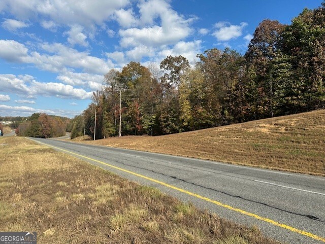 Explore your options! 26.79 acres of wooded property with approximately 1,643' of road frontage on Highway 515 North near Cherry Log. DOT access rights to property included