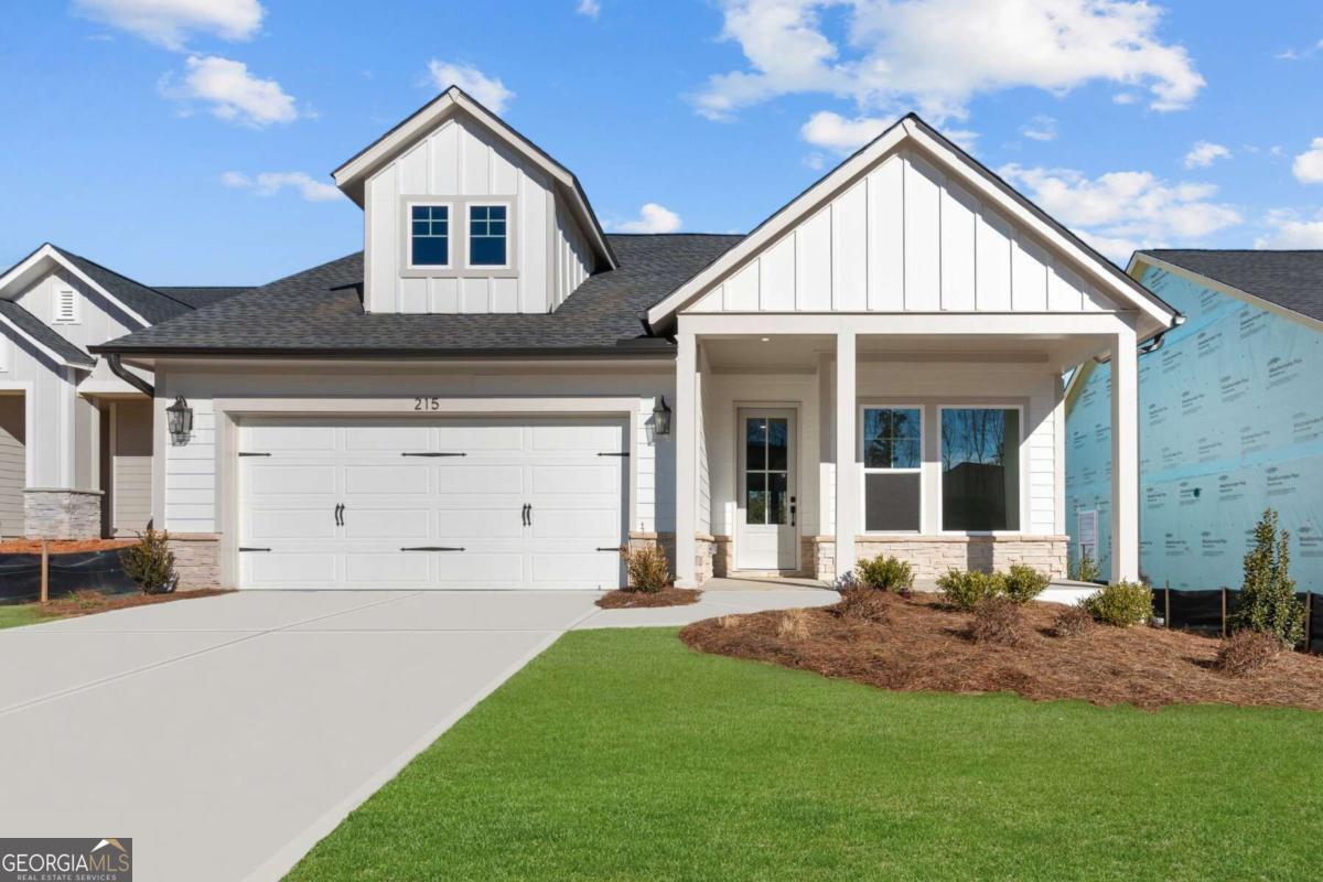 Welcome to your stunning new home in Maple Grove at Towne Lake! The Cartwright II by David Weekley Homes is a luxurious and thoughtfully designed floor plan, perfect for those who love to entertain and appreciate elegance. Step into a welcoming study off the entryway, providing versatility for a home office, library, or special-purpose space. The gourmet chef's kitchen is an entertainer's dream, featuring a deluxe pantry and a spacious center island, ideal for meal prep and gatherings. Enjoy the modern, interconnected living space, designed for seamless flow and interaction. The main areas effortlessly connect, creating an inviting atmosphere for creating cherished memories. Step outside to the extended covered porch, perfect for enjoying beautiful spring and summer evenings. The additional spare bedroom offers flexibility for guest accommodations or can serve as a hobby room or home gym. The luxurious Super Owner's Retreat features a contemporary en suite bathroom and a generous walk-in closet for ultimate convenience. This home perfectly blends sophistication, functionality, and entertainment possibilities, making it an ideal choice for luxury home seekers. Call David WeekleyCOs Maple Grove Team today to learn more about the industry-leading warranty and EnergySaverao features included with this new home for sale in Woodstock, GA! DonCOt miss your chance to experience the elegance of The Cartwright II! Home under Construction. Please call for an appointment.