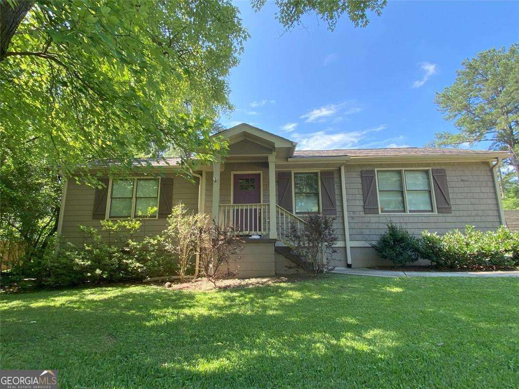 Your Dream Home Awaits in the Heart of Smyrna! This charming 3-bedroom, 2-bathroom home truly has it all - style, space, and an unbeatable location. The covered front porch welcomes you in to an open floorplan with hardwood floors throughout, a cozy living room with gas fireplace & custom built-in shelving, separate dining room and an updated kitchen featuring stainless steel appliances, granite countertops & gas range for cooking. The 2 secondary bedrooms are perfect for kiddos, guests or home office/gym/flex space, and are serviced by a full bathroom. The expansive primary suite, at the rear of the home, includes a large walk-in closet with custom closet system, spacious ensuite bathroom with double vanity, walk-in shower + garden tub, and direct access to the back porch. Outside, enjoy a large fully fenced backyard for privacy and safety - perfect for pets, play, and backyard BBQs. And parking is a breeze with the oversized driveway. A newer HVAC system and tankless water heater offer comfort and on-demand hot water. Location, location, location cannot be beat with close proximity to Smyrna Market Village, restaurants, shopping & a short walk to Tolleson Park. This home isn't just move-in ready - it's ready to be loved. Don't wait, schedule your showing today! (Home is NOT FURNISHED)