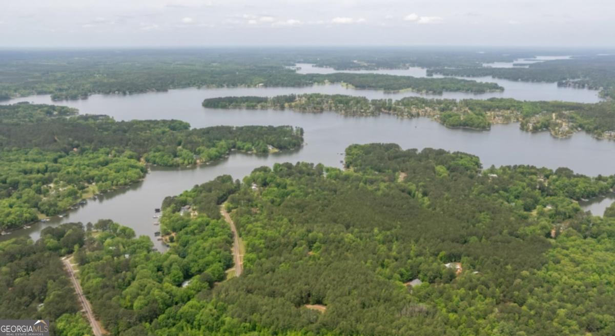Build your dream home on this beautiful 3+ acre lot located just down the street from Lake Oconee. This property offers a private, wooded setting with plenty of space for a primary residence, vacation retreat, or investment opportunity. Enjoy the convenience of nearby boating, fishing, golf, shopping, and dining, all while having the privacy of over 3 acres. With endless possibilities, this property provides the perfect combination of peaceful living and easy access to all that the Lake Oconee area has to offer.