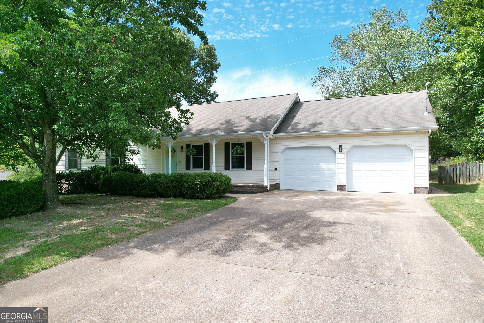Welcome home to 372 Castleview Dr! This beautifully renovated in 2025. It sits on nearly an acre and features a brand-new open floor plan. The kitchen boasts granite countertops with a bar, stainless steel appliances, and stylish finishes. Additional updates include new windows, HVAC, carpet, lighting, and waterproof wide-plank flooring throughout. The spacious living room offers vaulted ceilings and a cozy gas fireplace, while the oversized primary suite features a tray ceiling and a luxurious ensuite bath. Step outside to enjoy the updated deck and patio overlooking a fenced backyard-perfect for entertaining or a quiet retreat. Relax with your morning coffee on the charming covered front porch. Located in the desirable Mill Creek neighborhood, just over a mile from the TN/GA line and only 13 minutes from Hamilton Place Mall. Owner is a Licensed Real Estate Agent in TN. Buyer is responsible to verify any and all information deemed important.