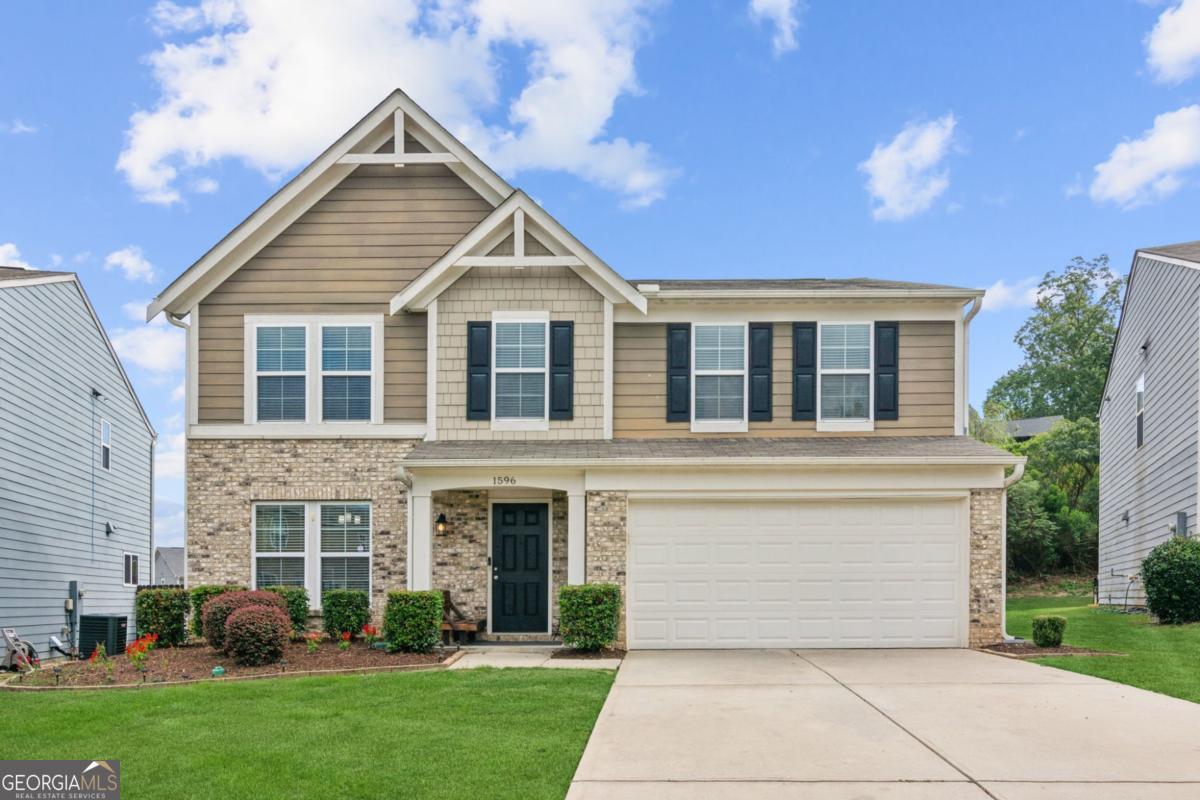 This beautiful home features an open-concept kitchen and family room, perfect for modern living. The kitchen shines with brand-new appliances, stone countertops, and a seamless flow into the living space, while a separate dining room offers the perfect spot for gatherings. Upstairs, you'll find 4 spacious bedrooms, including a comfortable owner's suite. Enjoy the outdoors in the large fenced backyard, ideal for play and entertaining. Located just minutes from downtown Sugar Hill's shops, dining, and entertainment, this home also sits in a community with swimming, tennis, and a playground. All appliances are included-making this a truly move-in ready home!
